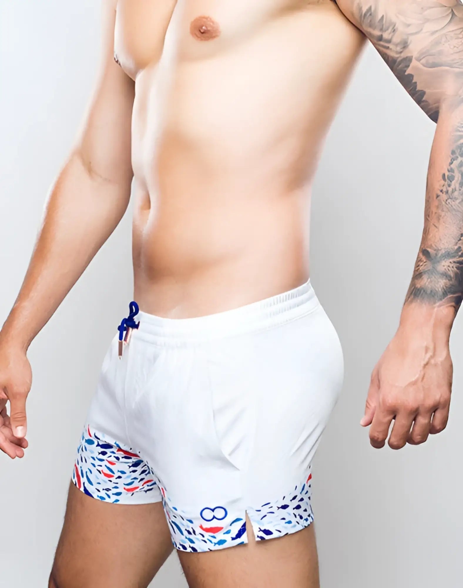 White 2eros printed bronte swim trunks with vibrant blue red and white abstract pattern along hem and side pockets