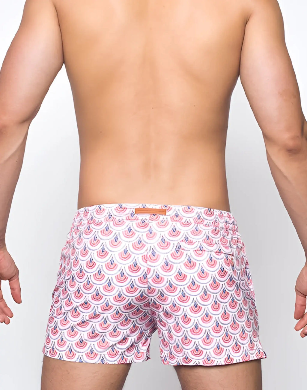 White 2EROS printed Bronte shorts featuring a repeating pink and navy blue scalloped pattern swim trunks