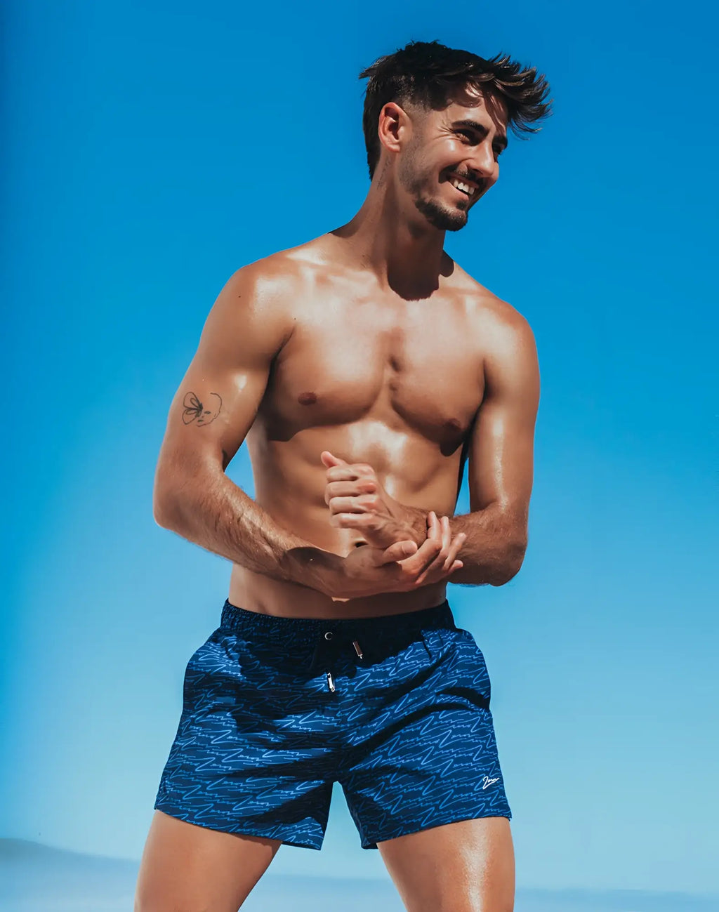 2eros printed bronte shorts in signature navy with blue wave pattern and black waistband for swimwear use