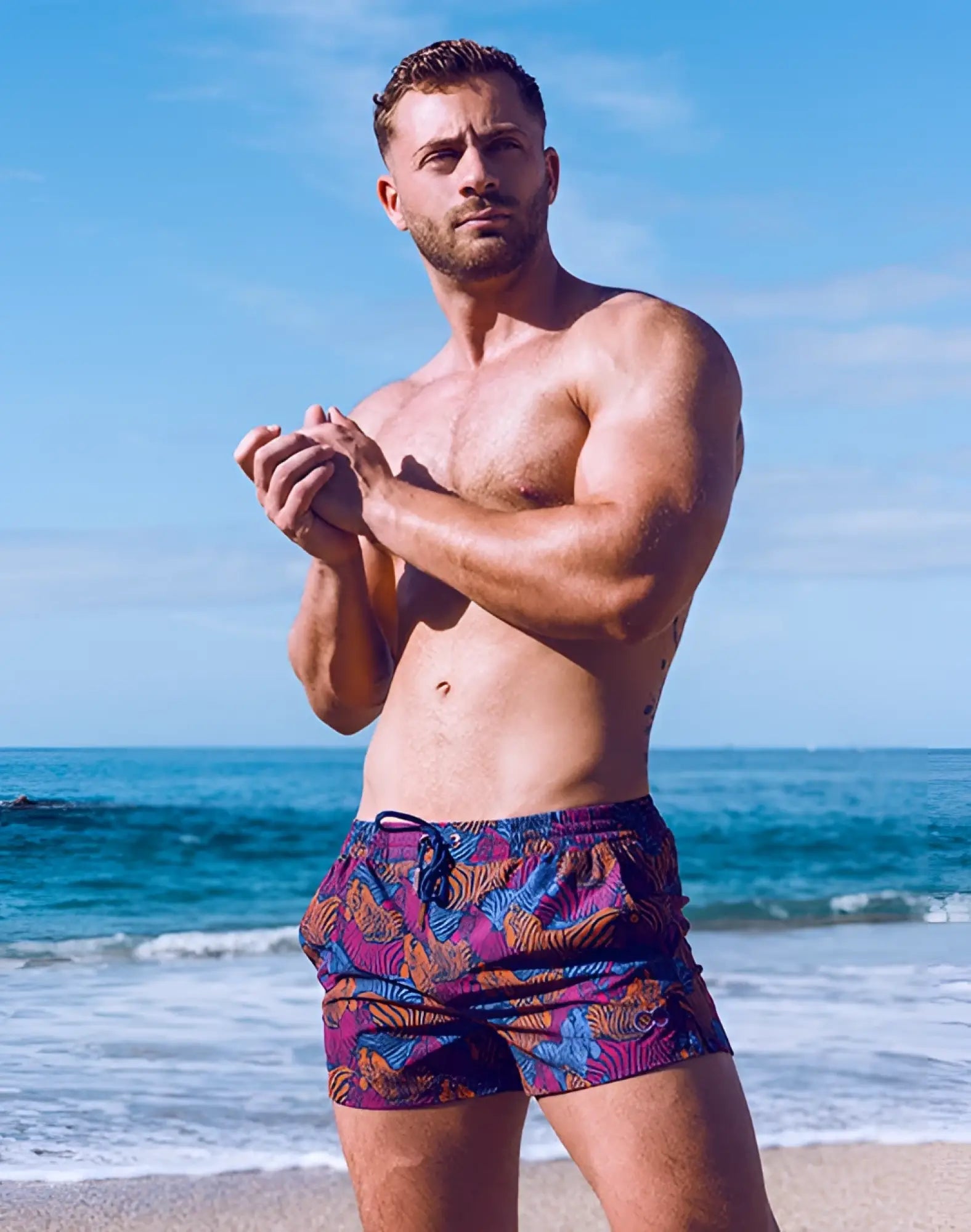 Men’s 2eros printed bronte shorts stallion navy featuring vibrant purple orange and blue tropical leaf swim trunks
