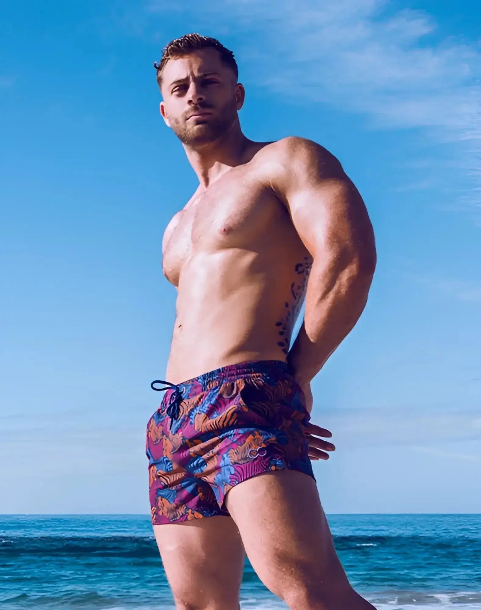 2eros printed Bronte shorts in stallion navy with vibrant purple and blue tropical patterned swim trunks design