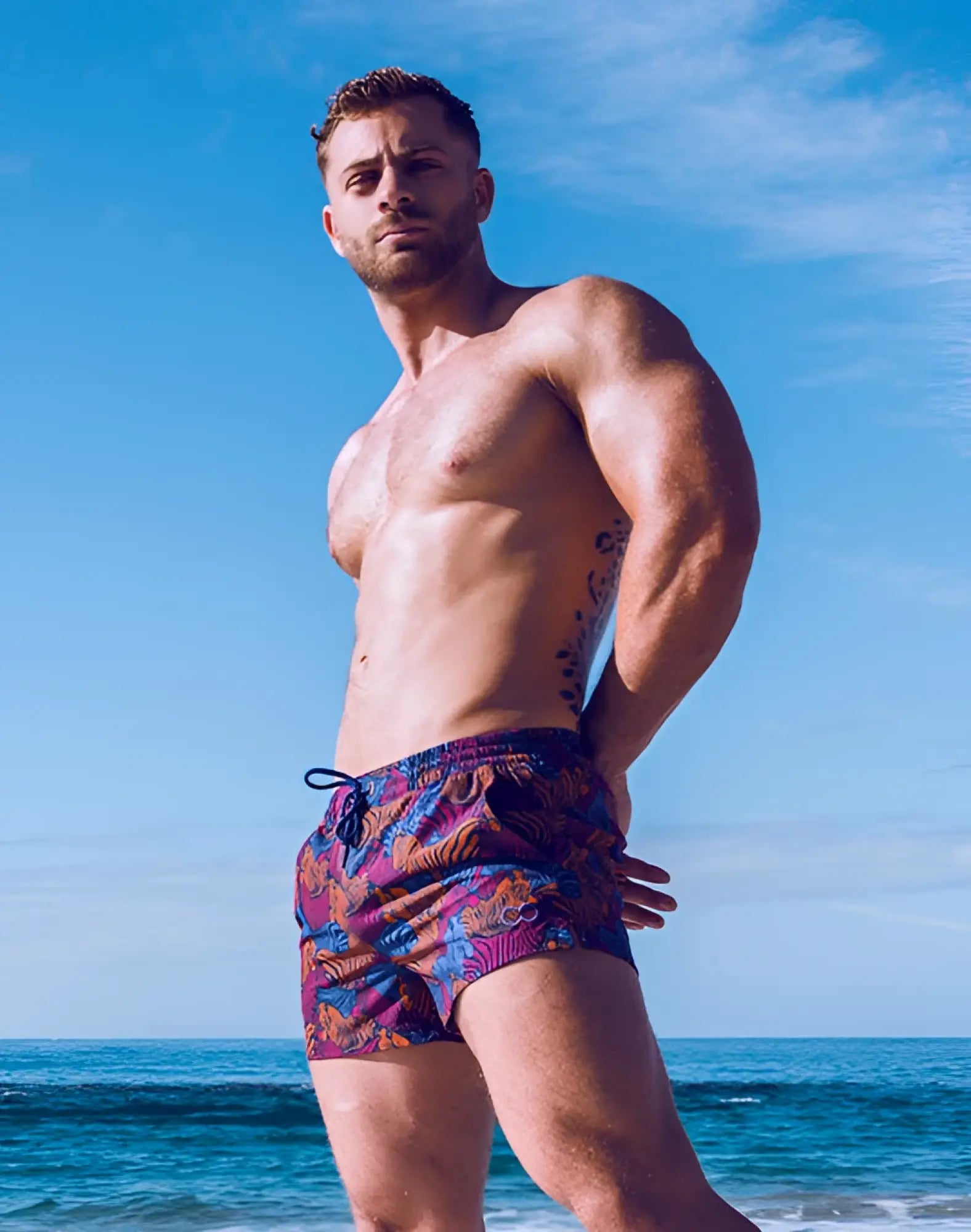 2eros printed Bronte shorts in stallion navy with vibrant purple and blue tropical patterned swim trunks design