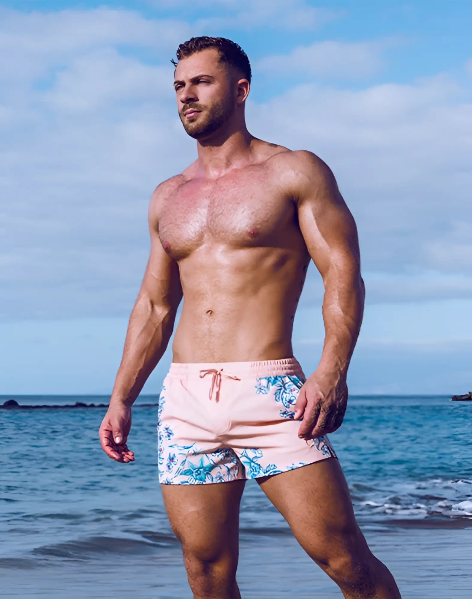 Pink swim trunks with blue floral pattern and matching drawstring 2EROS printed Bronte shorts Tahiti peach