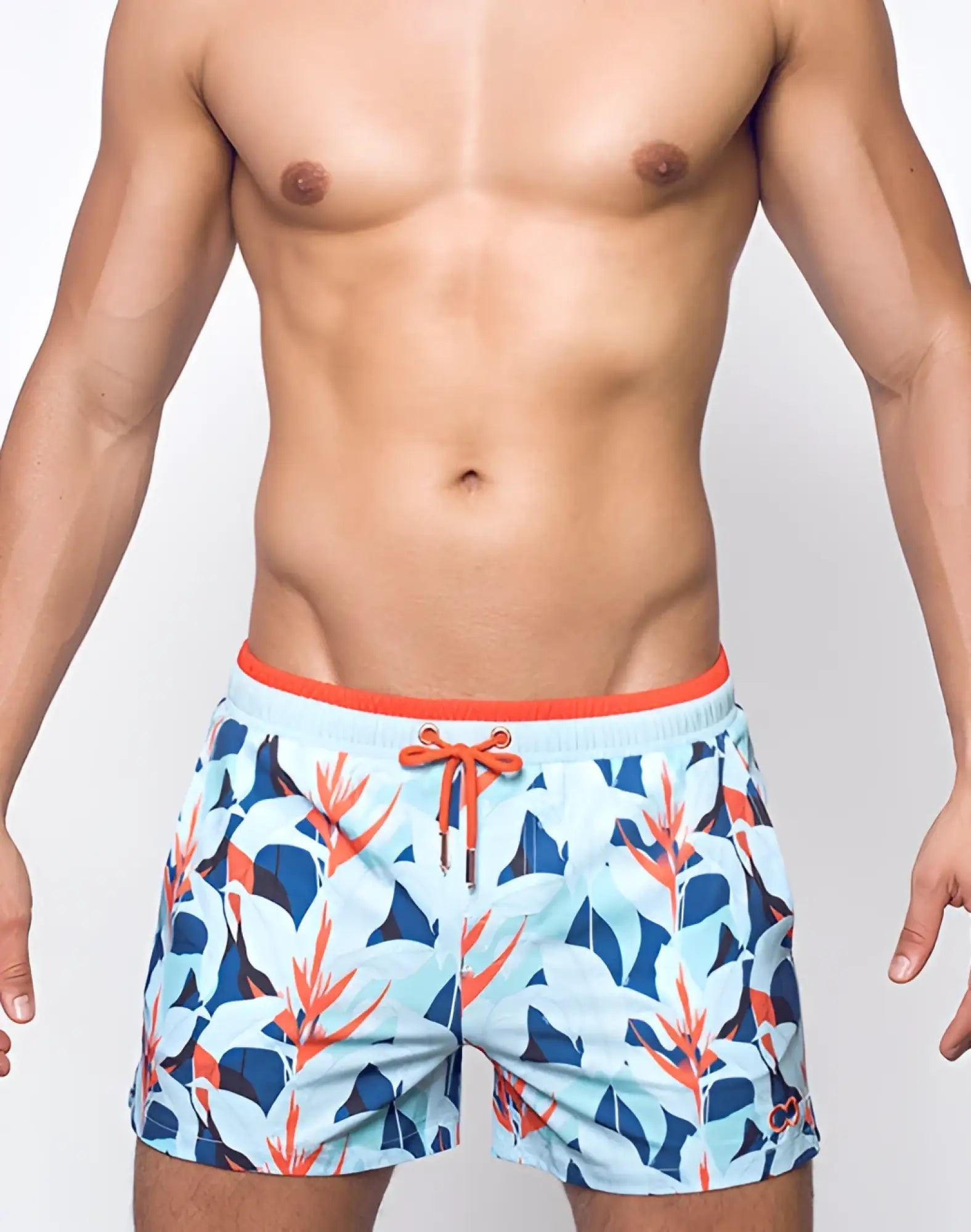 Men’s light blue 2EROS printed Byron shorts with vibrant navy and coral tropical leaves and orange waistband