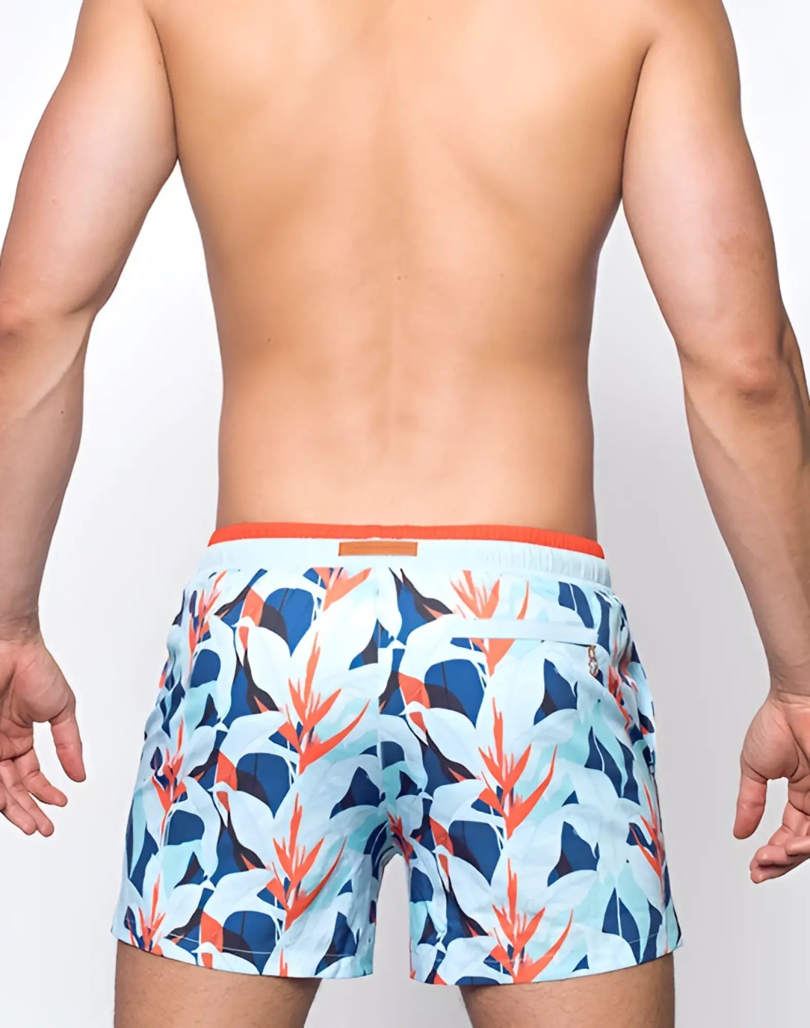 Men’s 2EROS printed Byron shorts with vibrant blue white and orange tropical leaf pattern swim trunks Caribbean twist