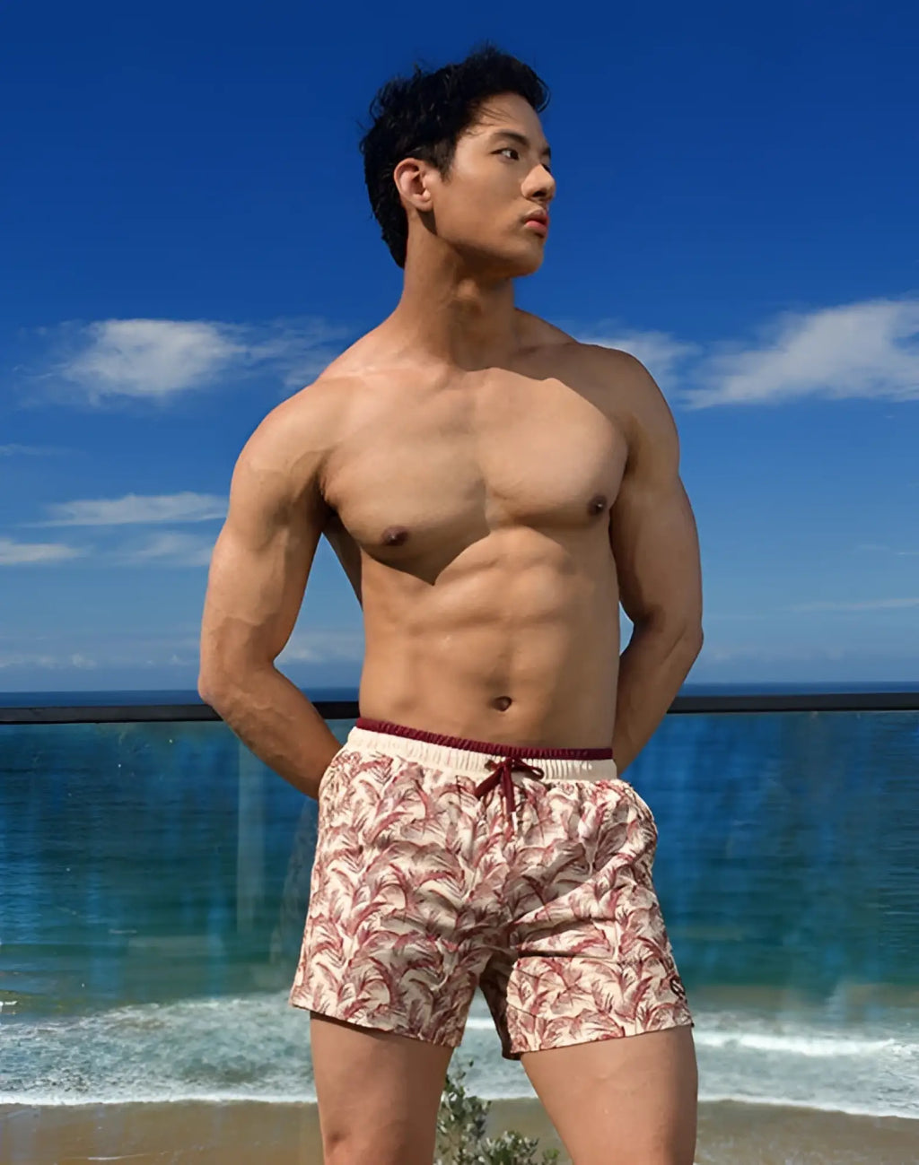 Beige and maroon palm leaf patterned 2EROS Printed Byron Shorts with a drawstring waistband for swimwear use