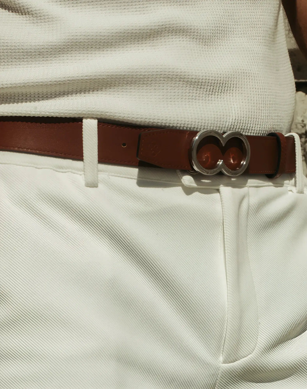 Brown leather reversible belt by 2EROS with a distinctive silver-toned double-circle buckle in black and brown