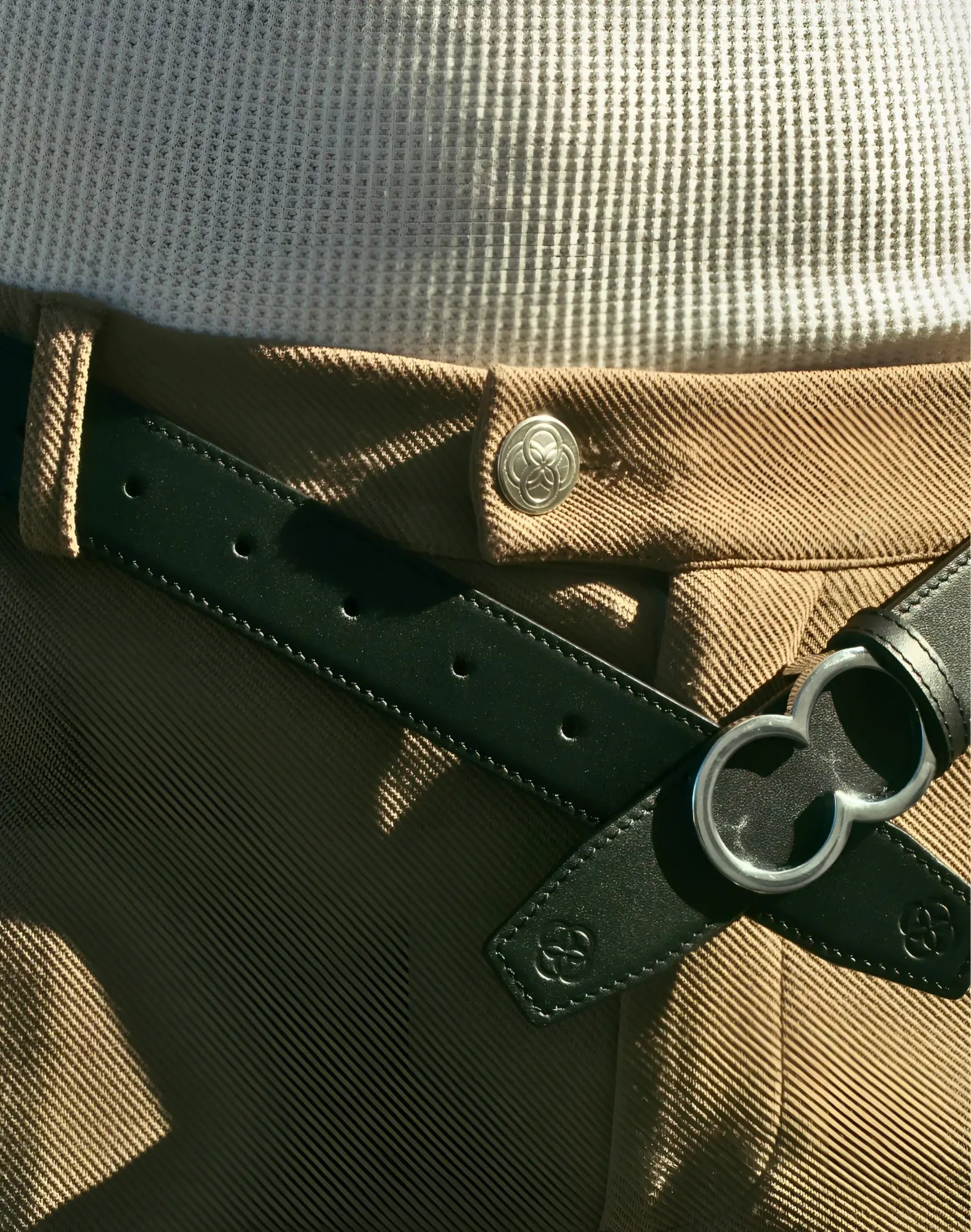 Black leather 2EROS reversible belt with silver double-ring buckle and embossed logo details in black and brown