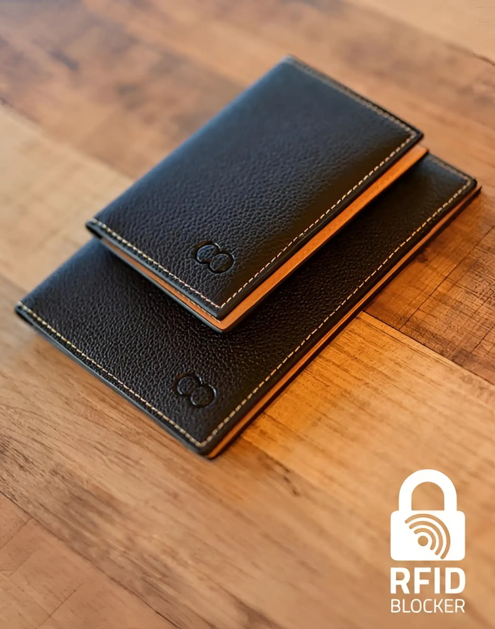 Black leather 2EROS RFID icon card holder with tan stitching and subtle embossed logo for secure card protection