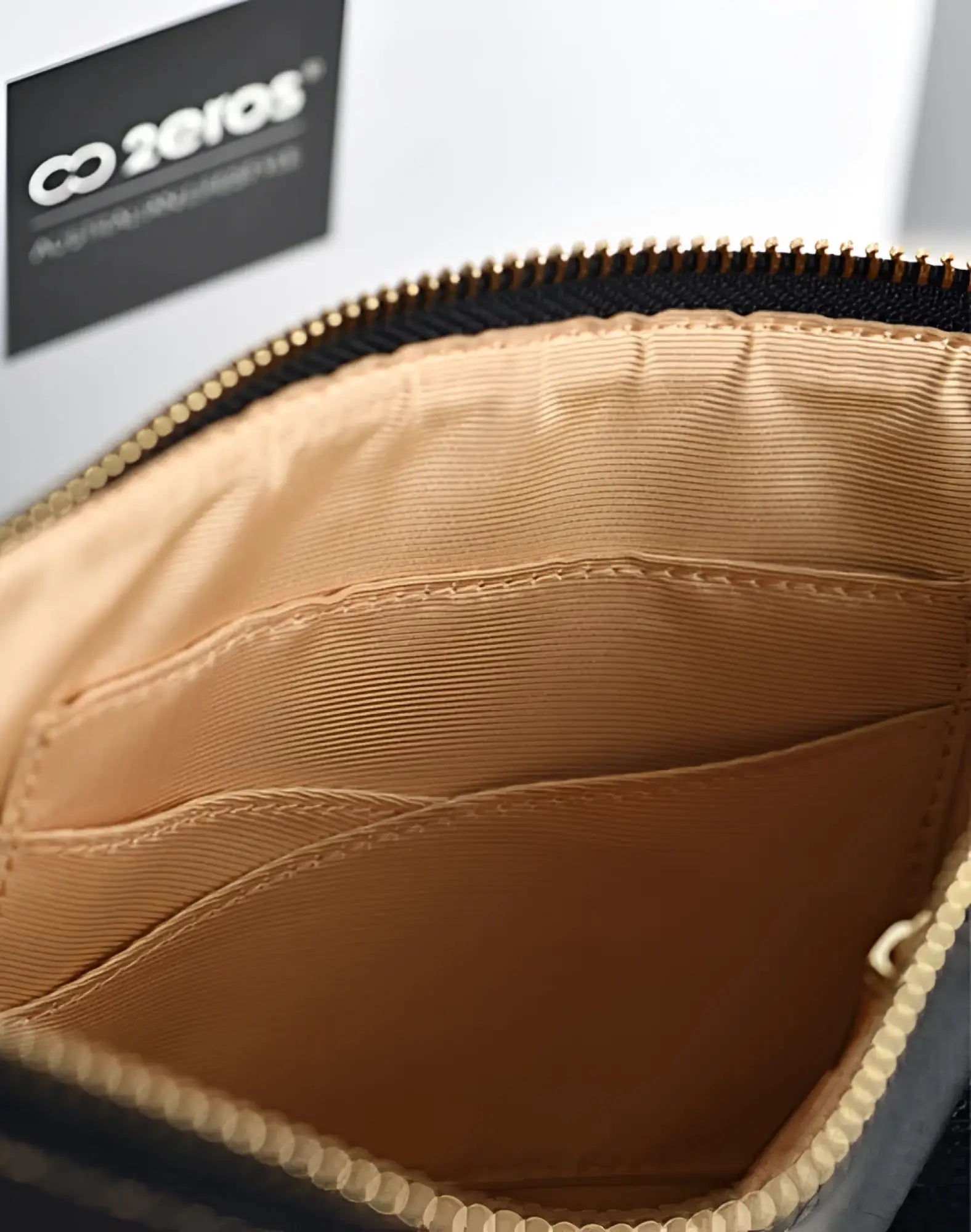 Black leather 2EROS RFID icon carry all crossbody bag with gold-tone zipper and tan interior lining