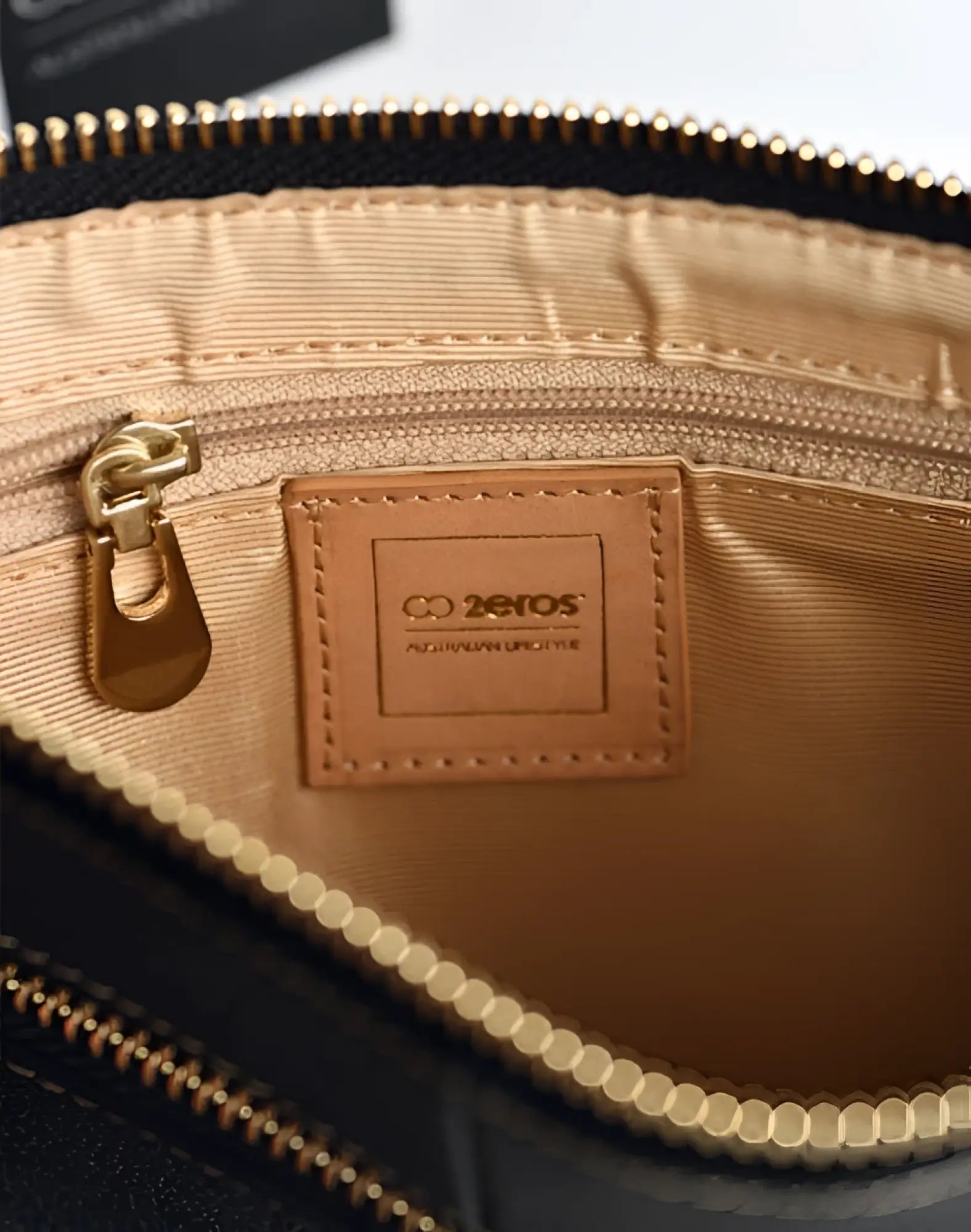 Black leather 2EROS RFID Icon Carry All crossbody bag with gold-tone zipper and interior lining