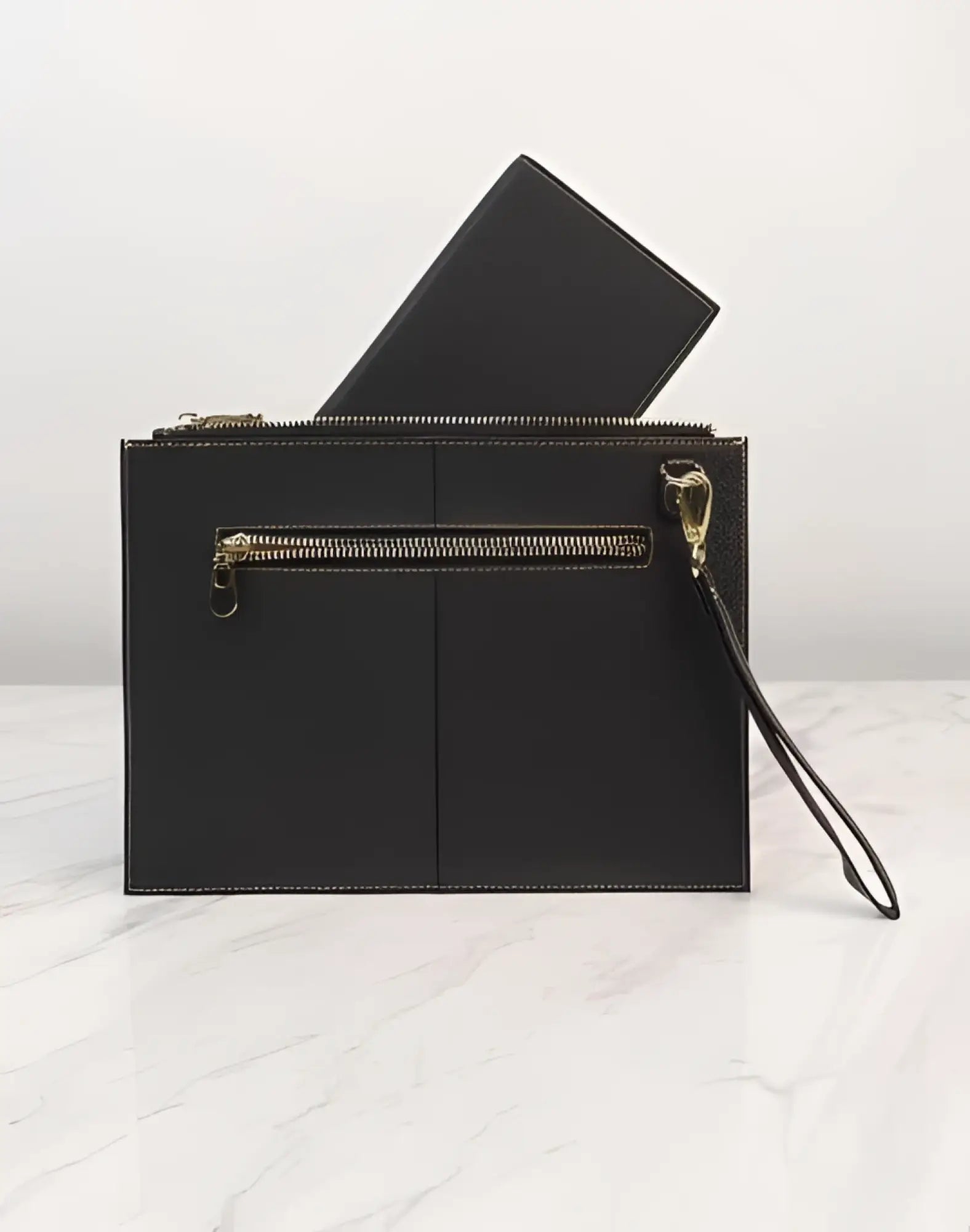 Black textured leather 2EROS RFID icon passport wallet clutch with gold-tone zippers and wrist strap