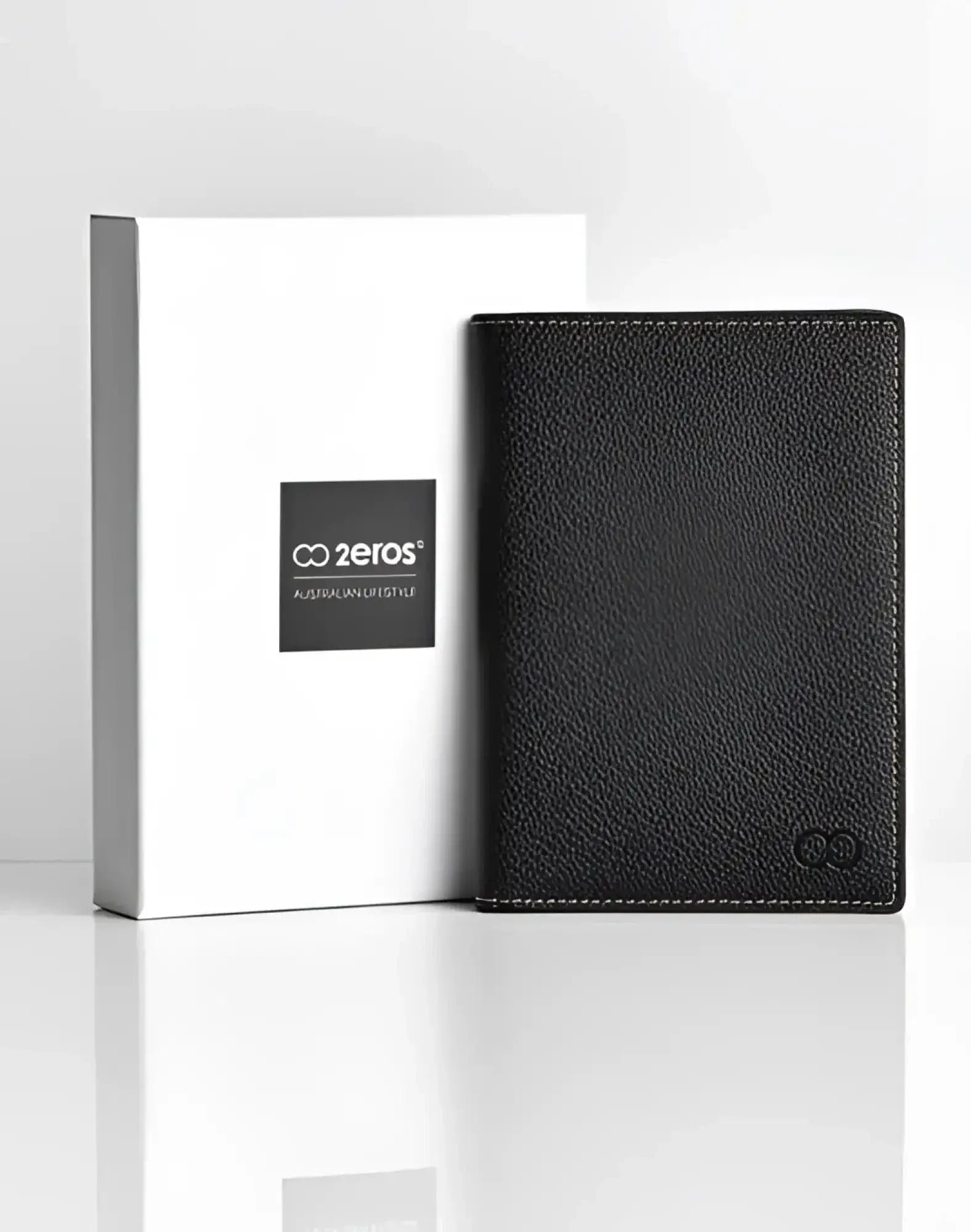 Black textured leather 2EROS RFID icon passport wallet with subtle stitching and small embossed logo in the corner