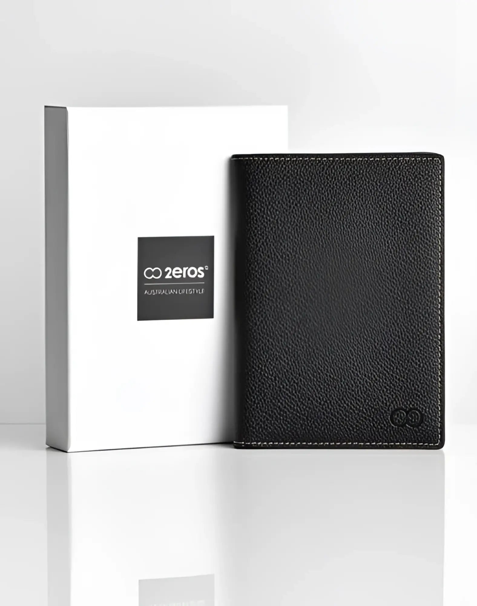 Black textured leather 2EROS RFID icon passport wallet with subtle stitching and small embossed logo in the corner