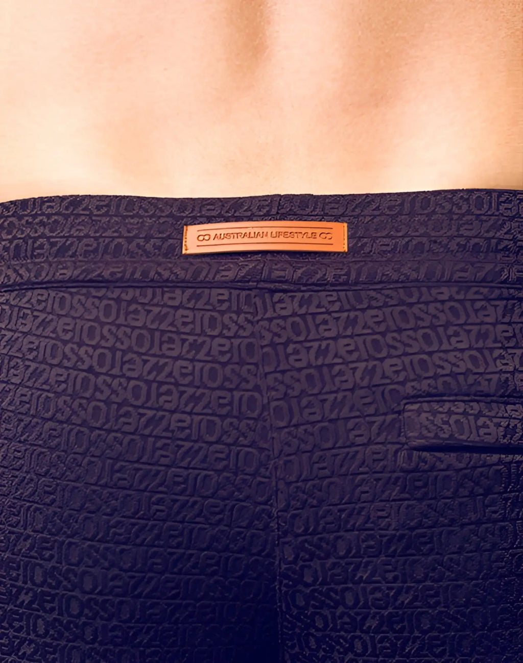 Dark navy blue textured 2eros s90 manly shorts with repeating geometric pattern and orange leather brand tag