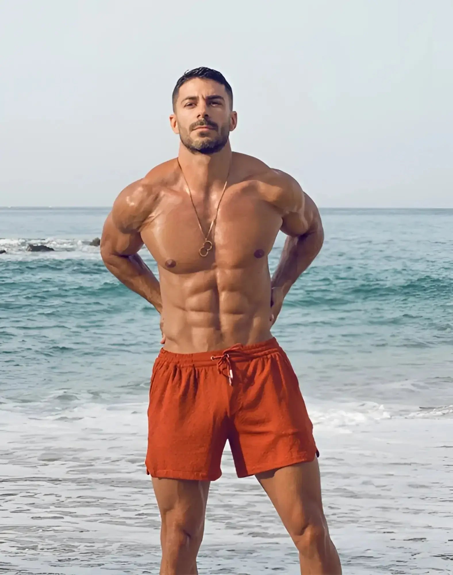Orange textured 2EROS S90 swim trunks with drawstring waistband designed for manly style and comfort