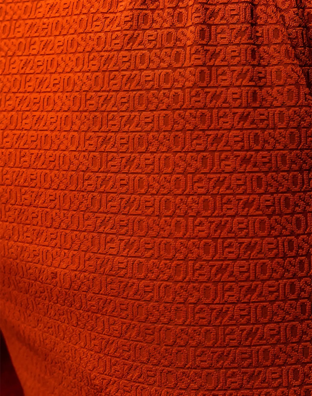 Vibrant orange 2eros s90 textured manly shorts with repeating geometric weave pattern in signet carmine color