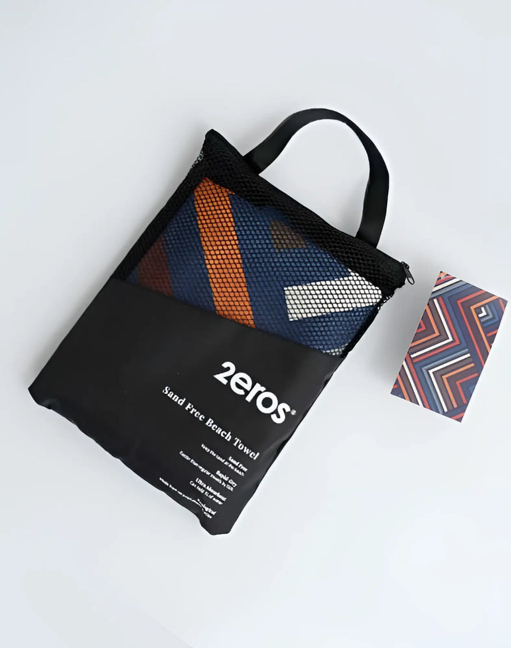 2eros sand free beach towel avant morocco in navy blue with orange and white stripes in black mesh carry bag