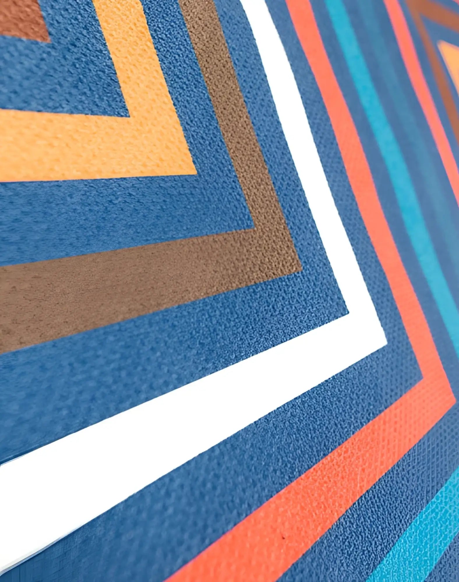 Vibrant geometric patterned 2eros sand free beach towel with bold blue orange brown and white zigzag stripes