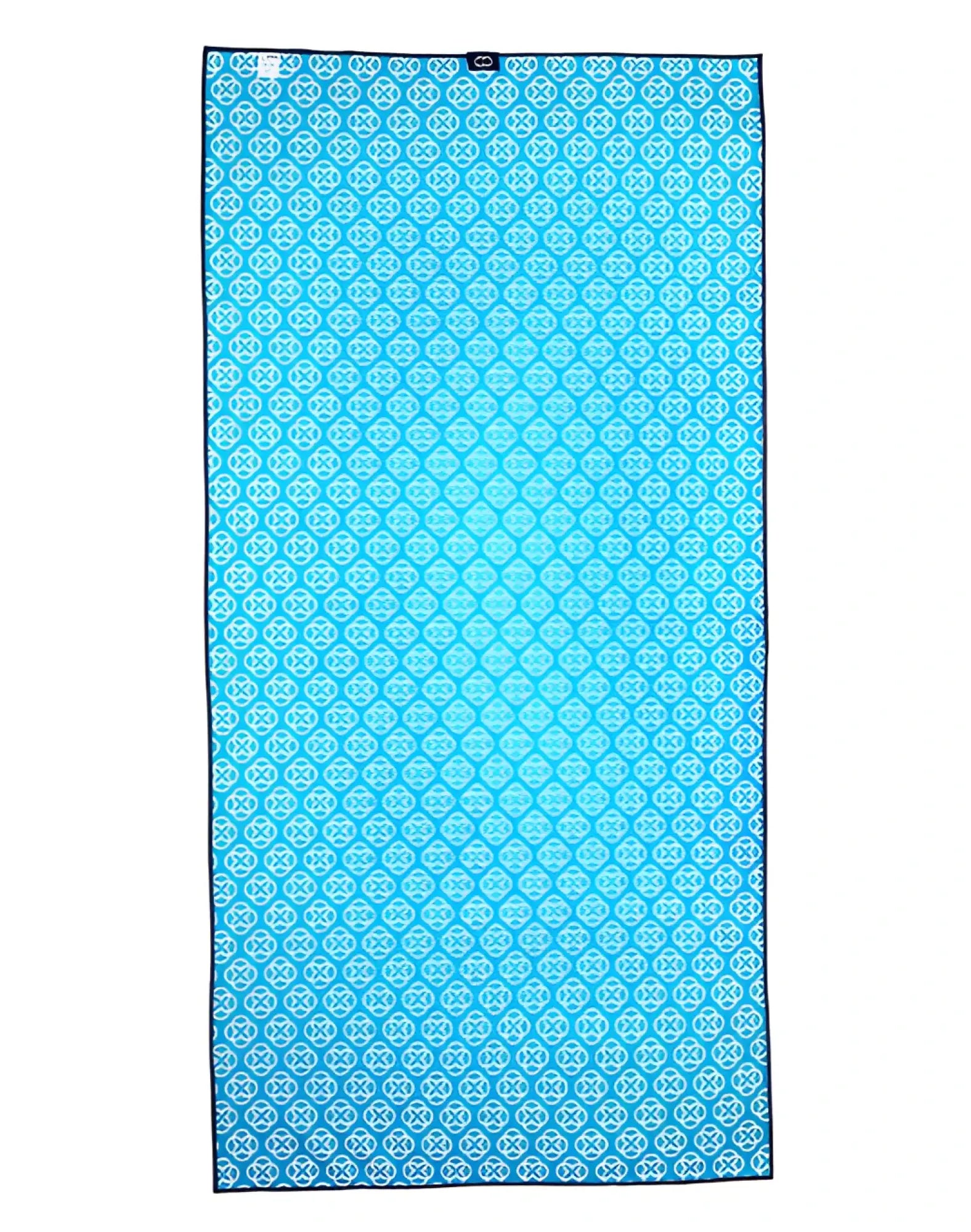 Turquoise microfiber 2EROS Sand-free beach towel with white geometric pattern and dark blue border for beach use