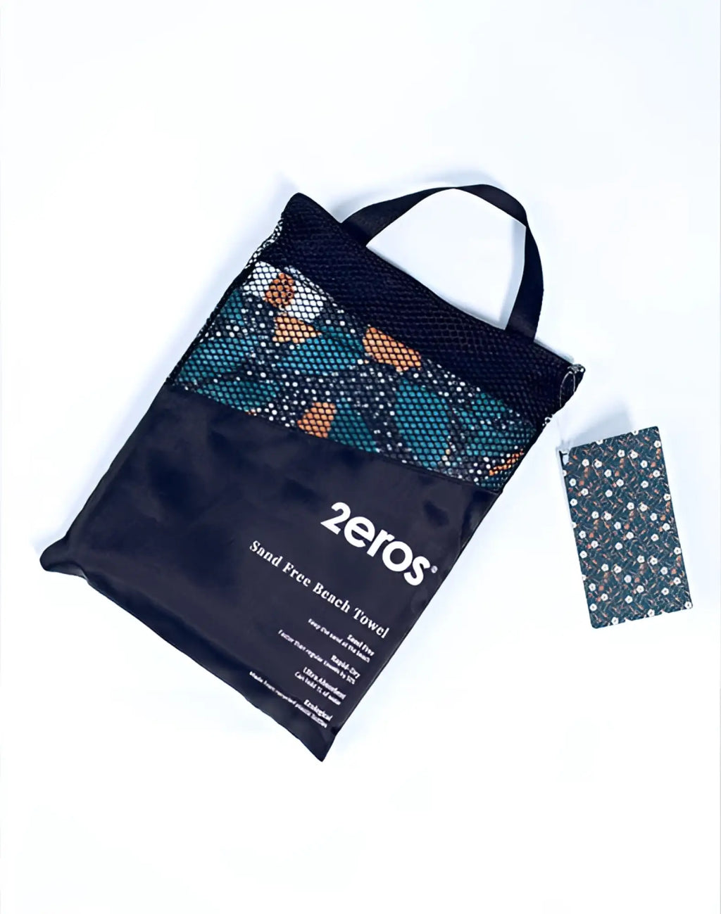 Black mesh carry bag with colorful geometric patterned 2eros sand free beach towel night bloom inside