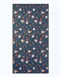 2EROS sand free beach towel night bloom with dense white blossoms green leaves and orange accents on dark teal background