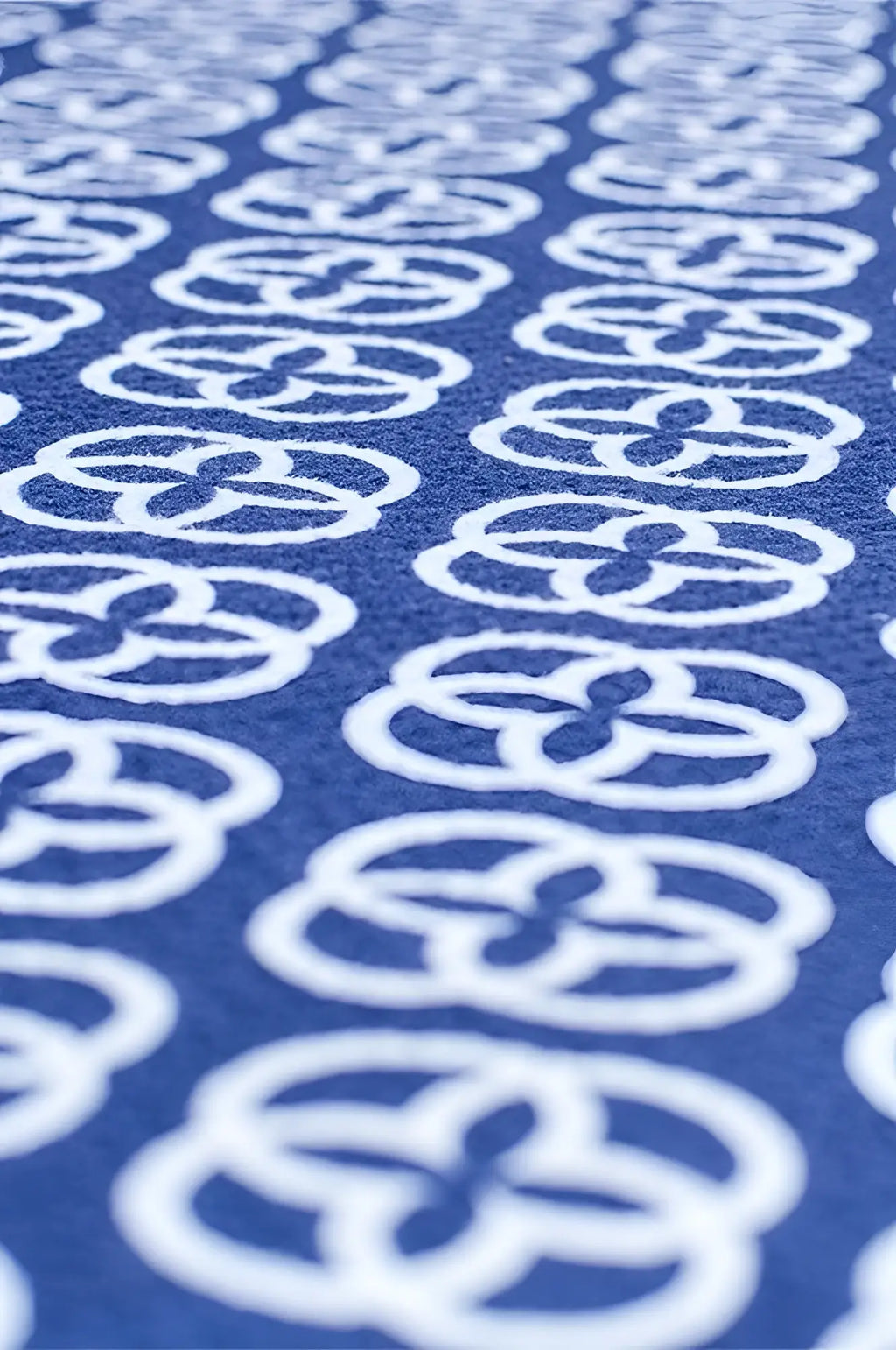2eros sand free beach towel yacht club with blue fabric and white interlocking circular pattern perfect for beach use