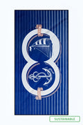 Navy blue striped 2eros sand free beach towel with white number eight and nautical motifs including sailboat and anchor