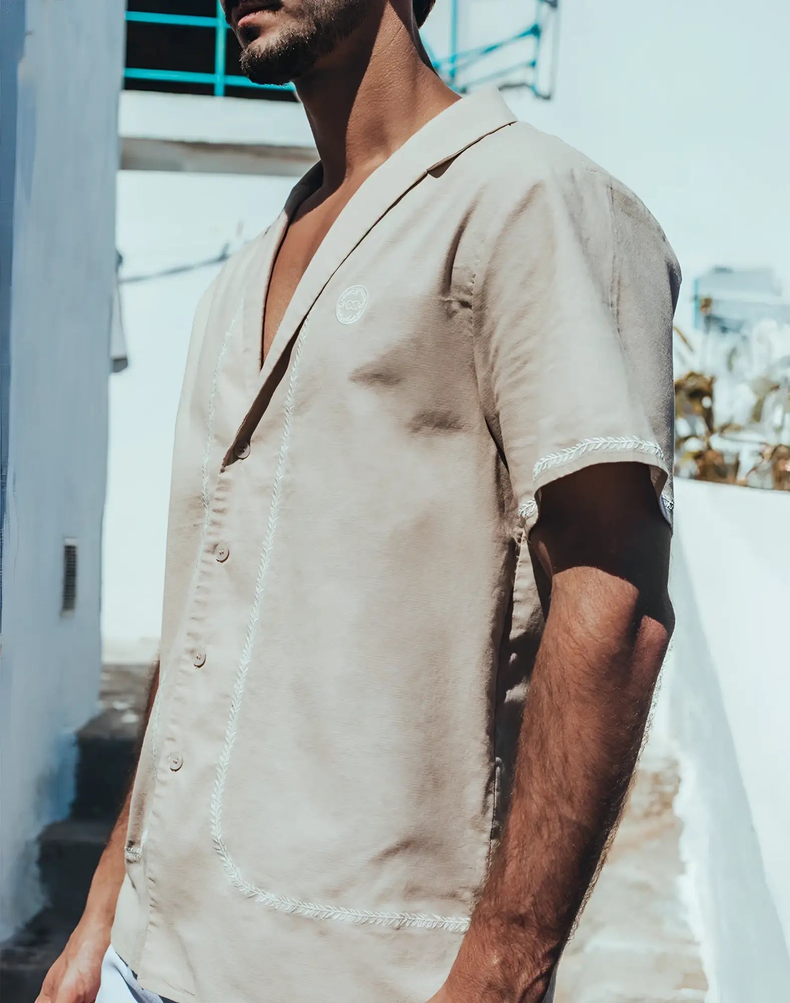 Beige linen 2EROS Santorini short-sleeved shirt with white stitching and subtle embroidered chest logo in taupe