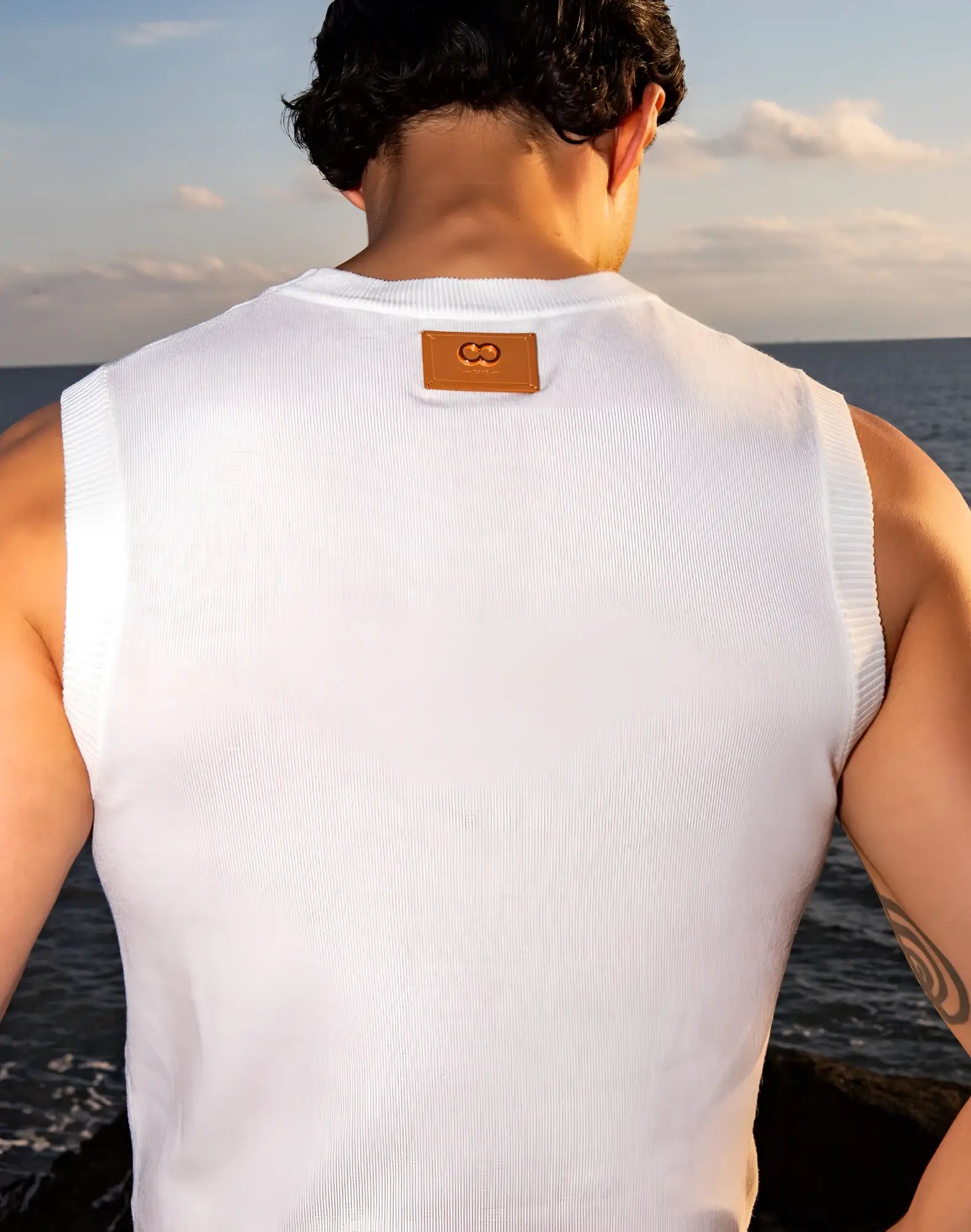 White ribbed knit sleeveless vest with tan leather patch neckline 2EROS sapphire knit vest white
