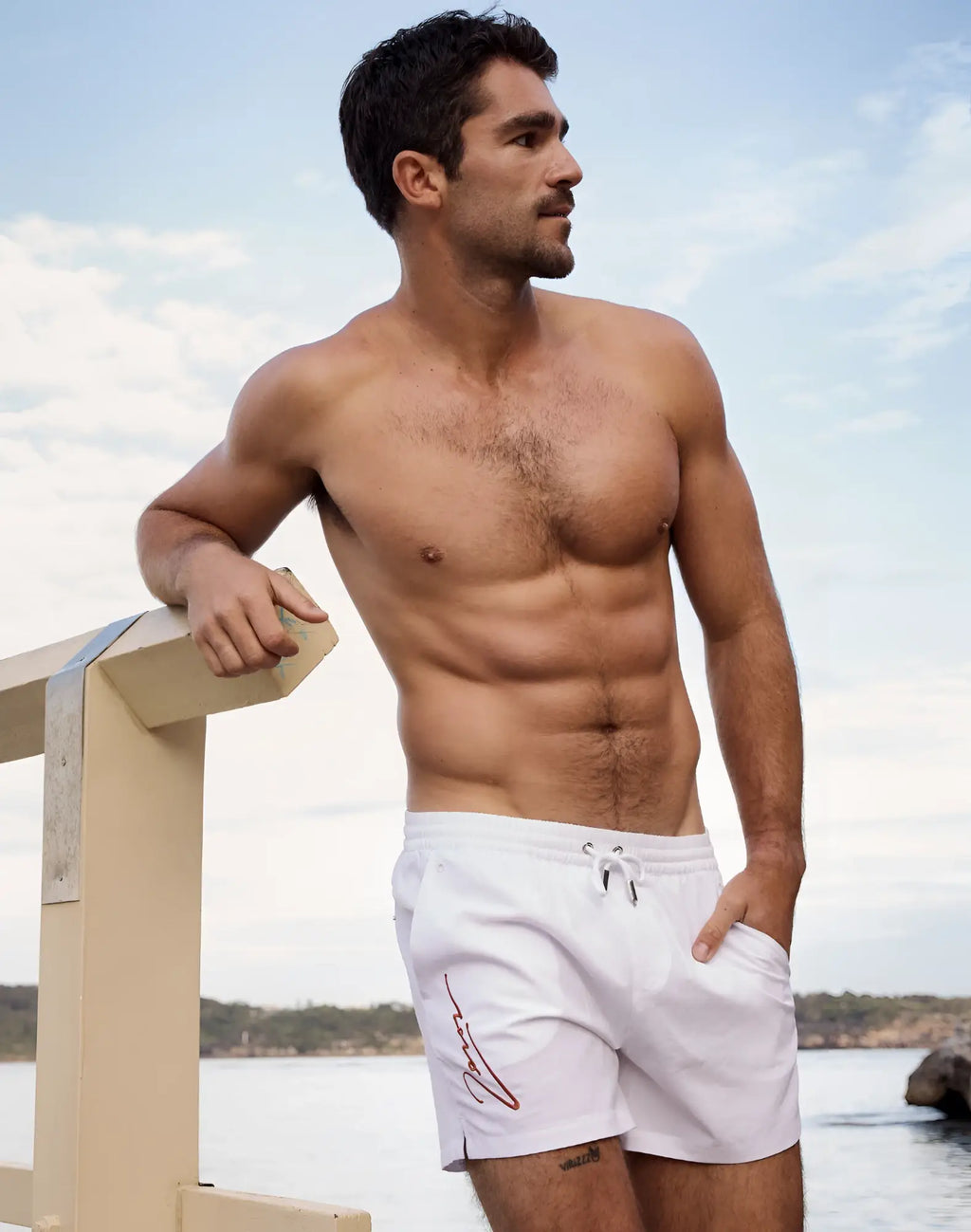 White 2eros signature byron swim trunks with red embroidered logo on left leg in lido white color