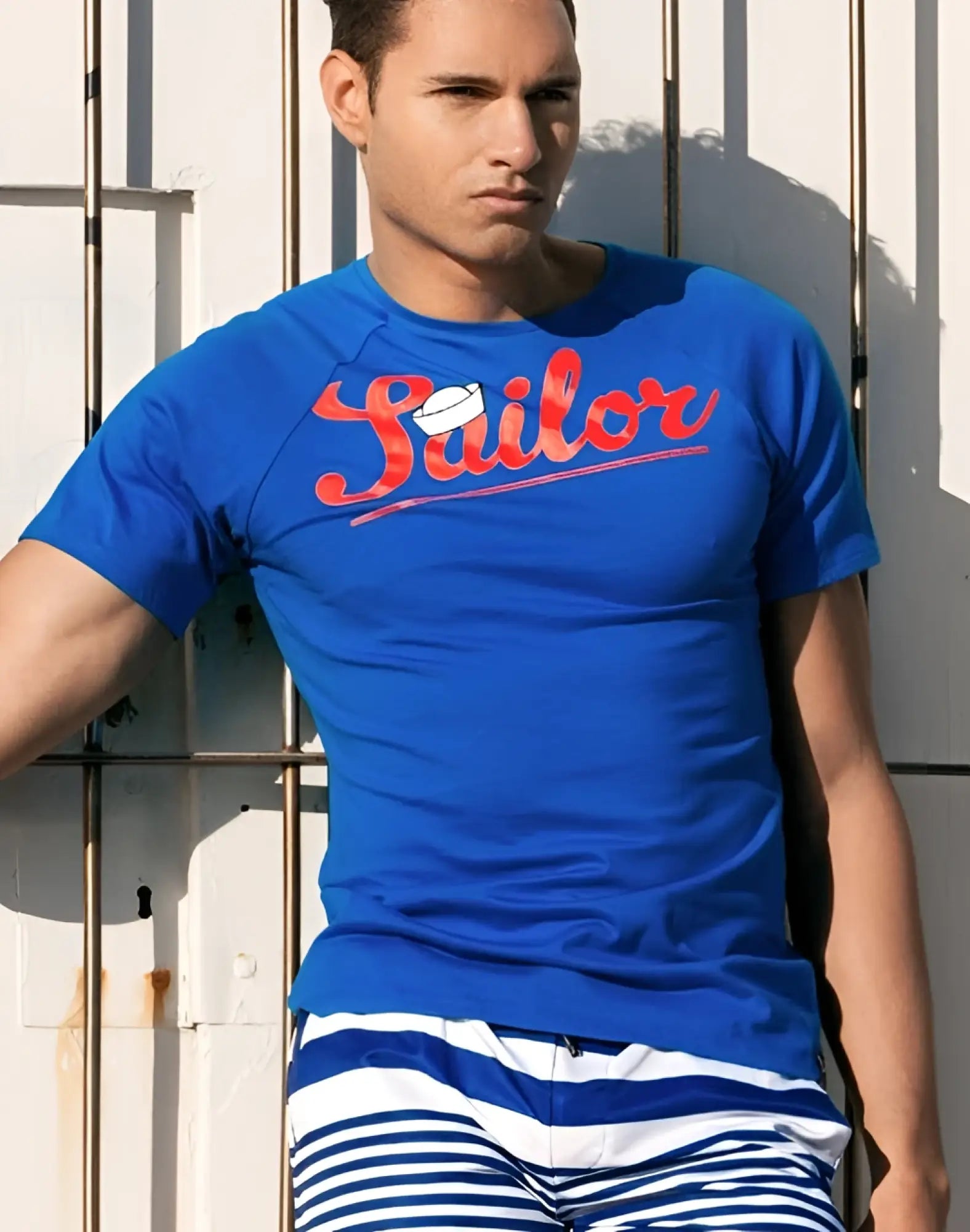 2EROS T20 sailor t-shirt in navy blue with red cursive lettering and a white sailor hat graphic on the front