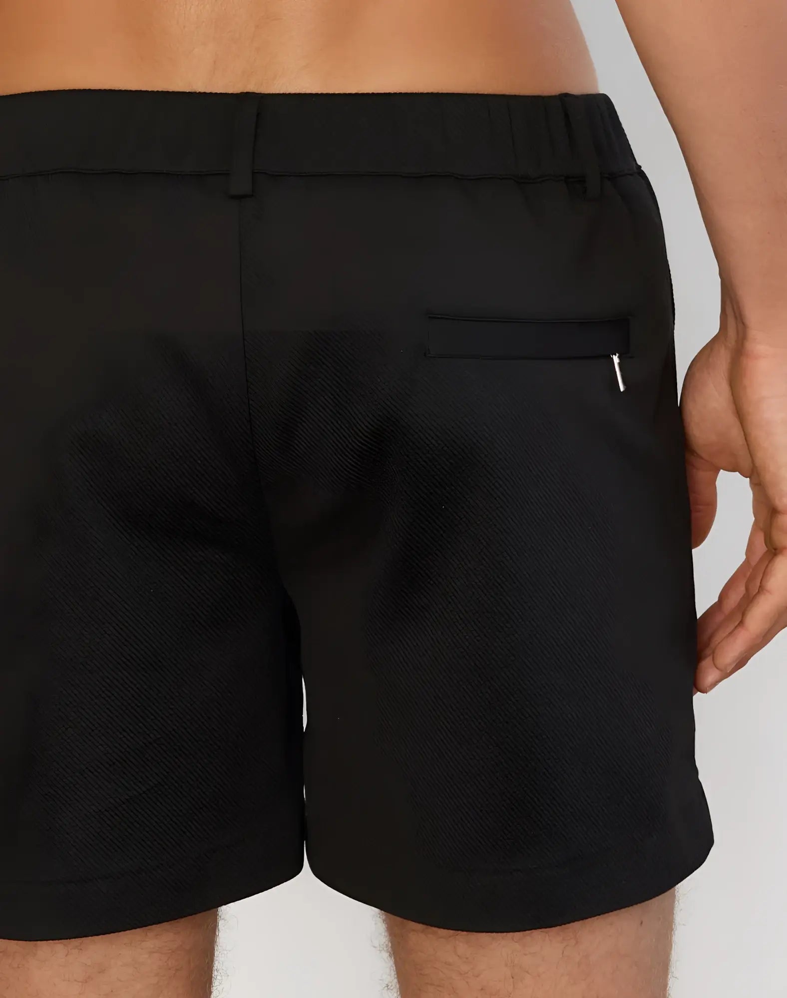 Black 2EROS Trinity shorts back view with elastic waistband and zippered pocket for secure athletic use