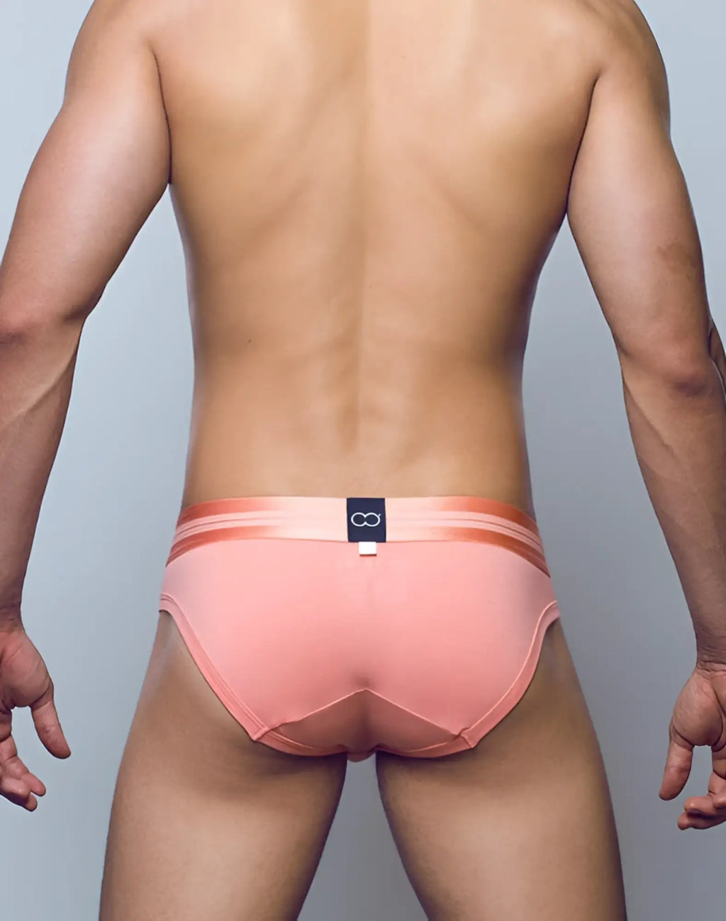 2eros u20 athena brief underwear in pink with orange trim and black logo tag on the waistband