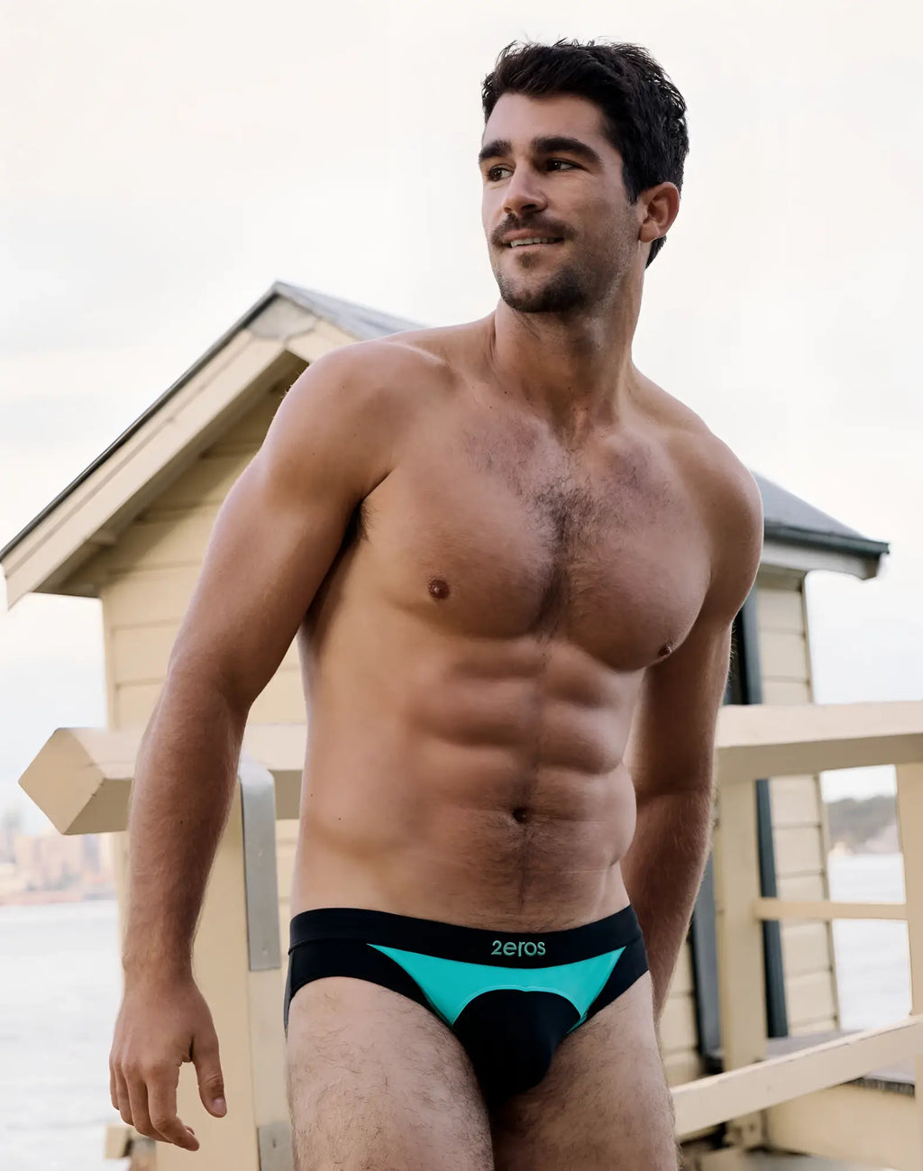 Black and teal 2eros v10 aktiv racer swim briefs with branded waistband designed for athletic performance