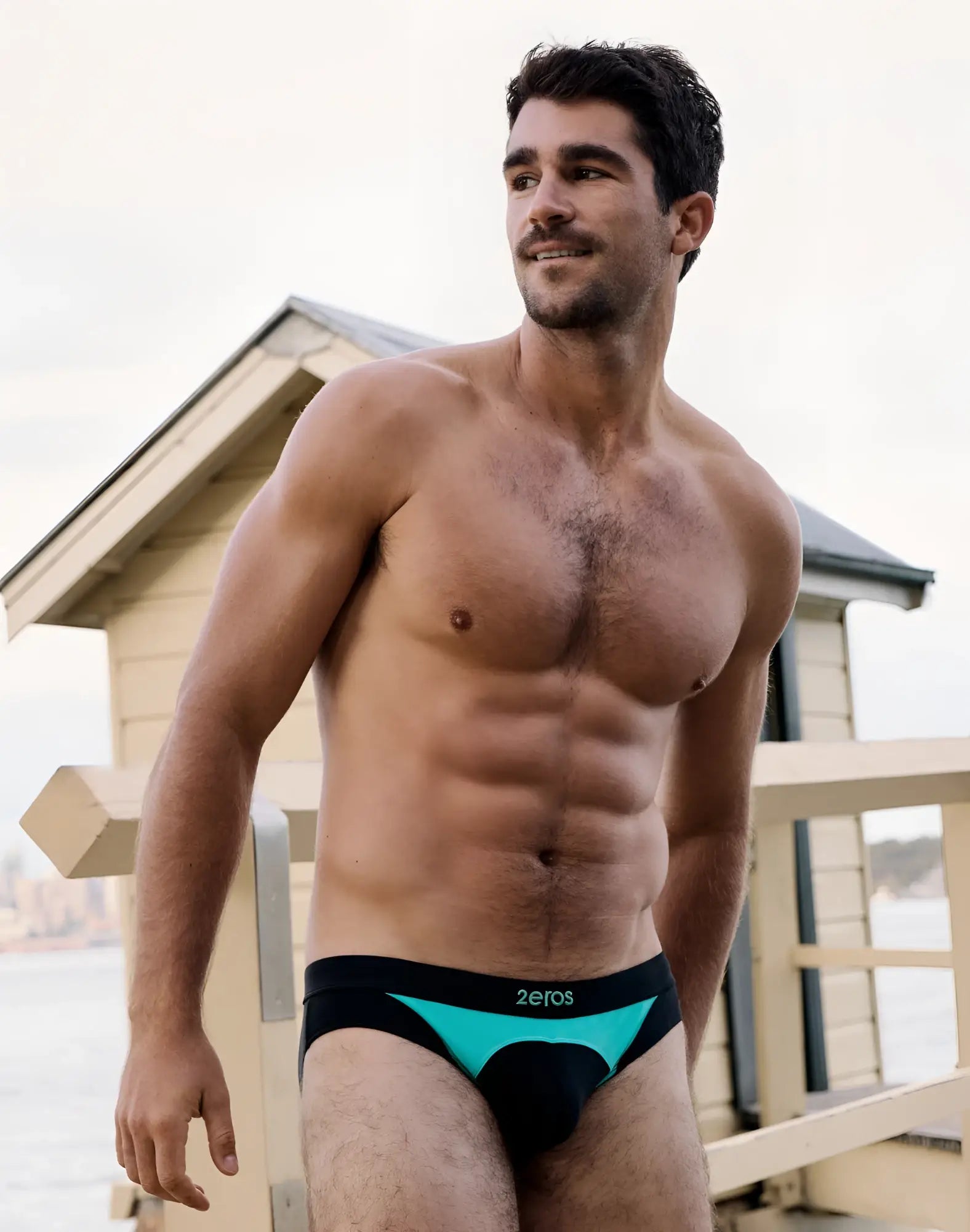 Black and teal 2eros v10 aktiv racer swim briefs with branded waistband designed for athletic performance