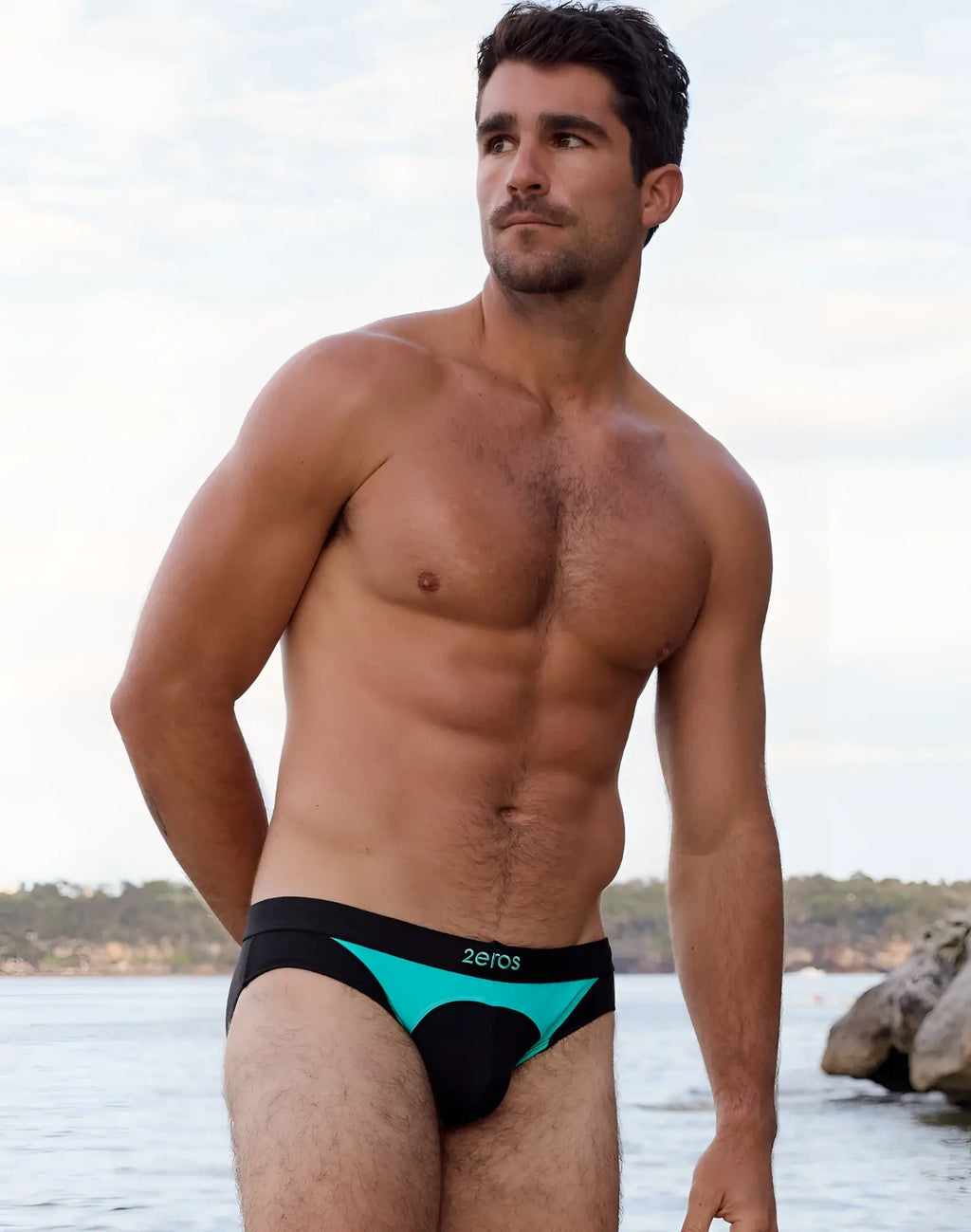 Black and teal 2eros v10 aktiv racer swim briefs with zeros logo waistband designed for men’s swimwear