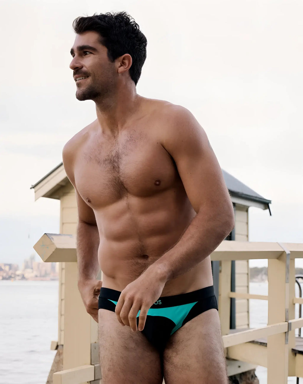 2eros v10 aktiv racer swim briefs in black and teal featuring a sleek modern design for competitive swimming