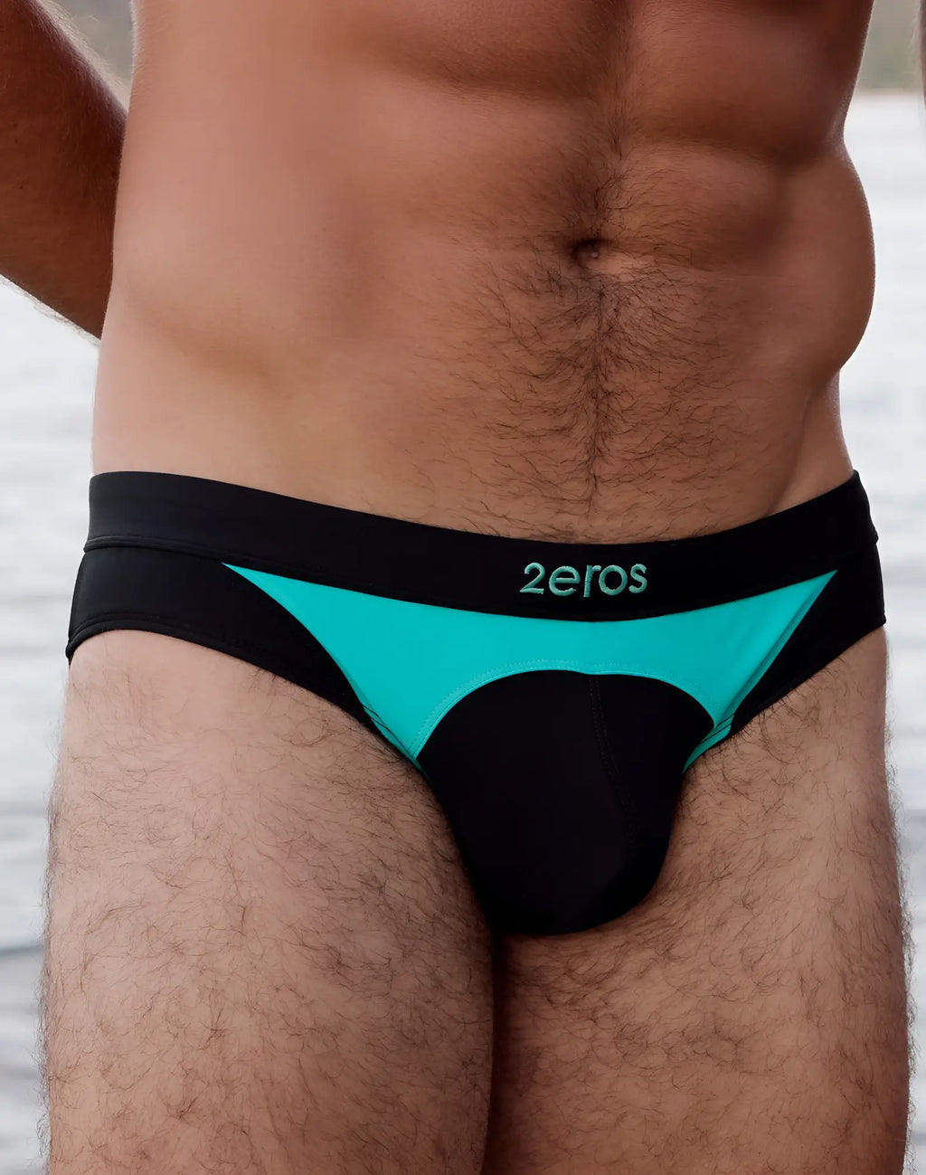 Black and teal 2EROS V10 AKTIV racer swim briefs with sleek modern design and 2eros logo on waistband