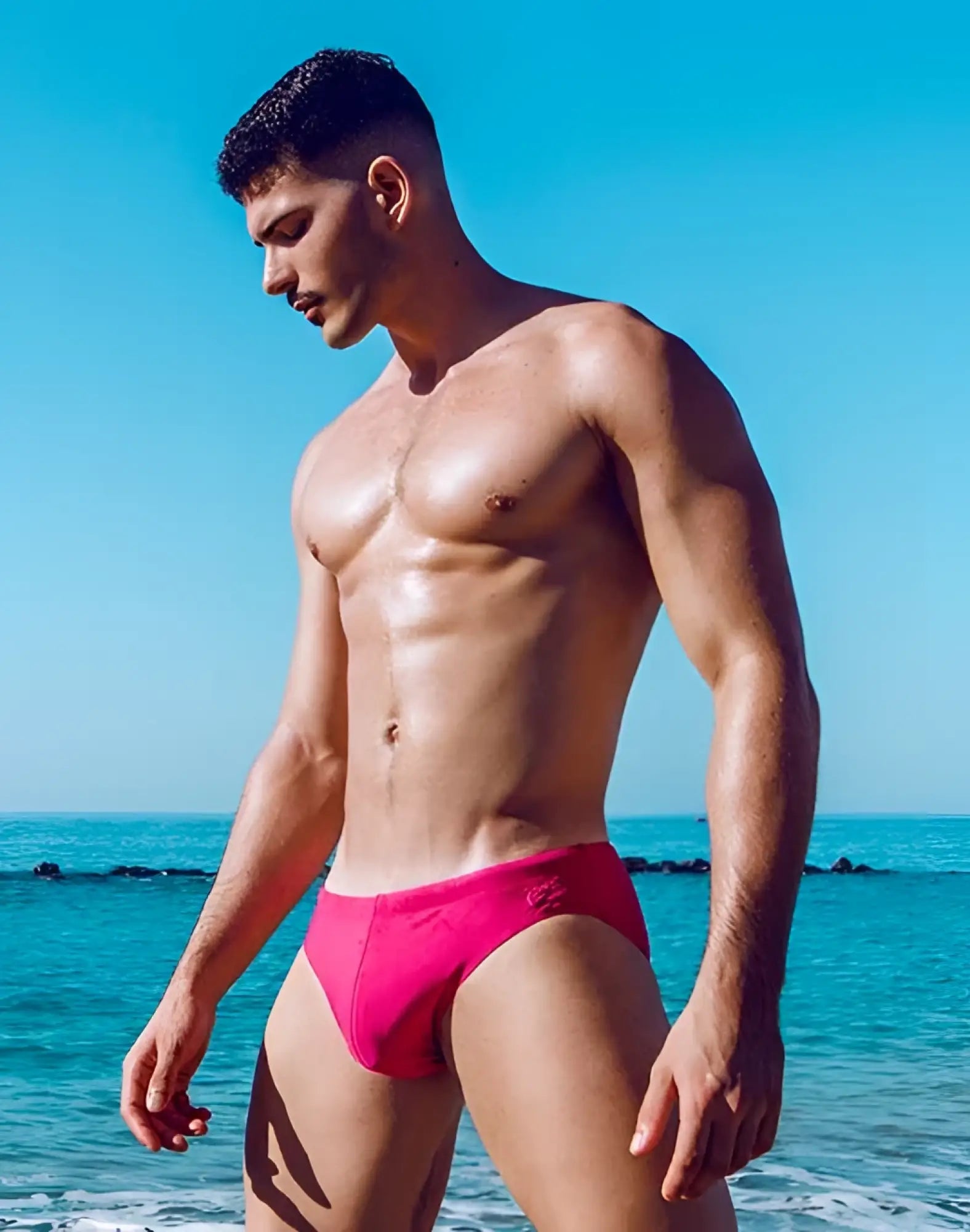 Bright pink 2EROS V10 Core Series 2 swim trunks with subtle logo on left hip designed for comfortable swimwear use