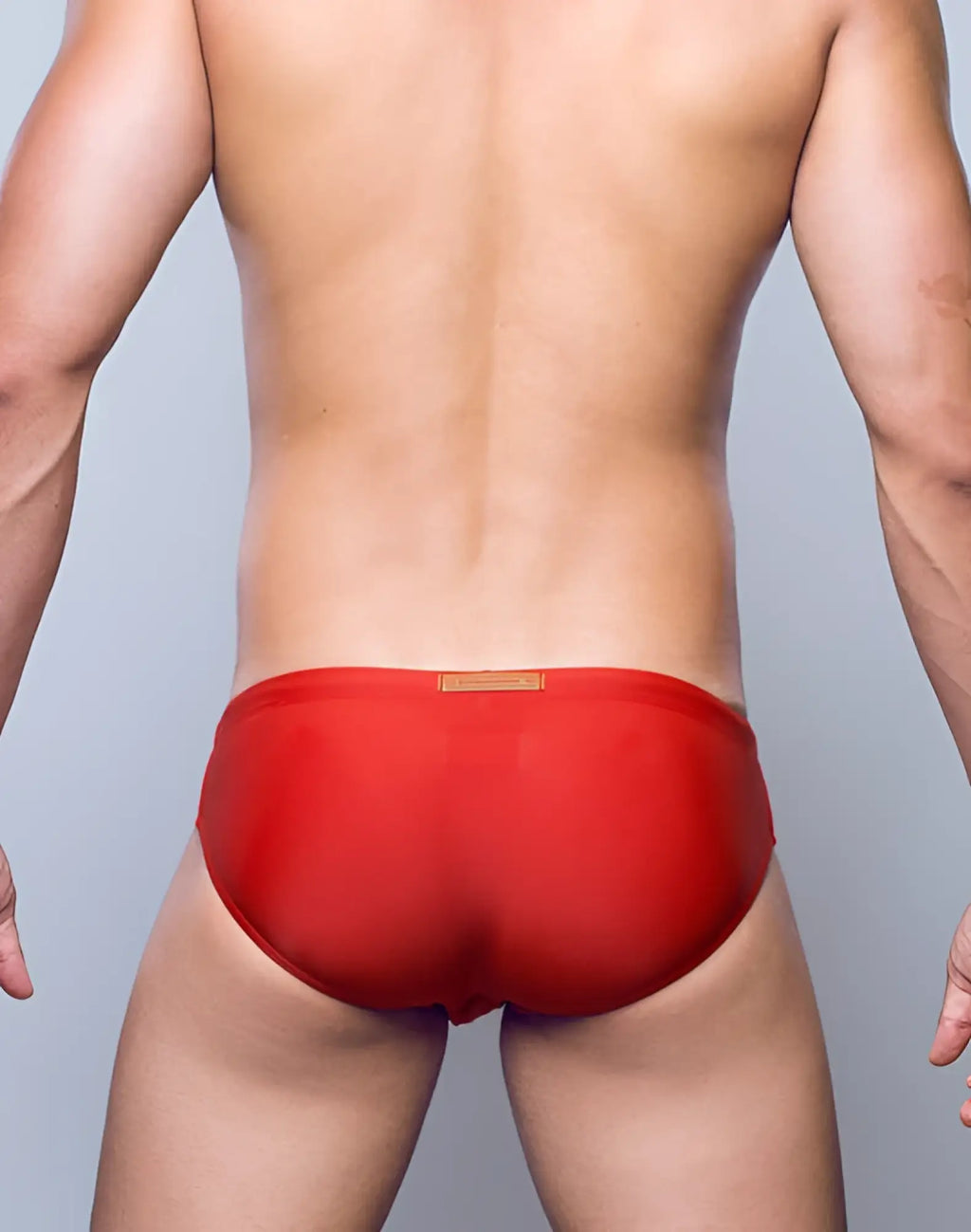 2eros v10 core series 2 red men’s briefs with a subtle orange tag ideal for swimwear in rust color