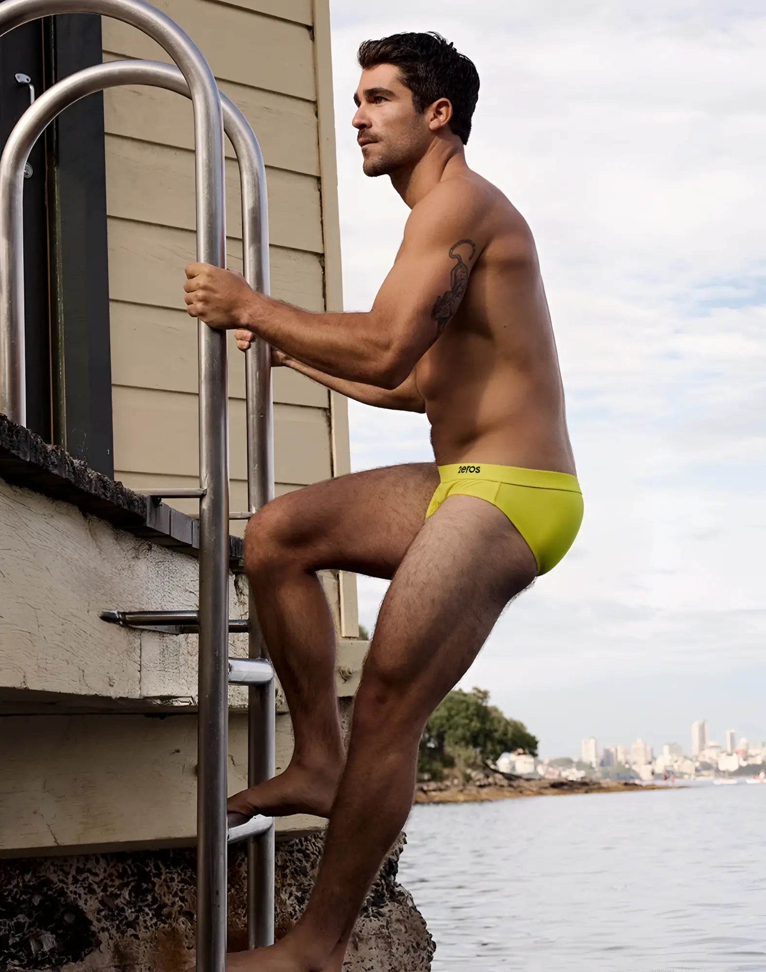 Bright yellow 2eros v10 encore swim briefs with subtle logo on waistband designed for swimming and beachwear
