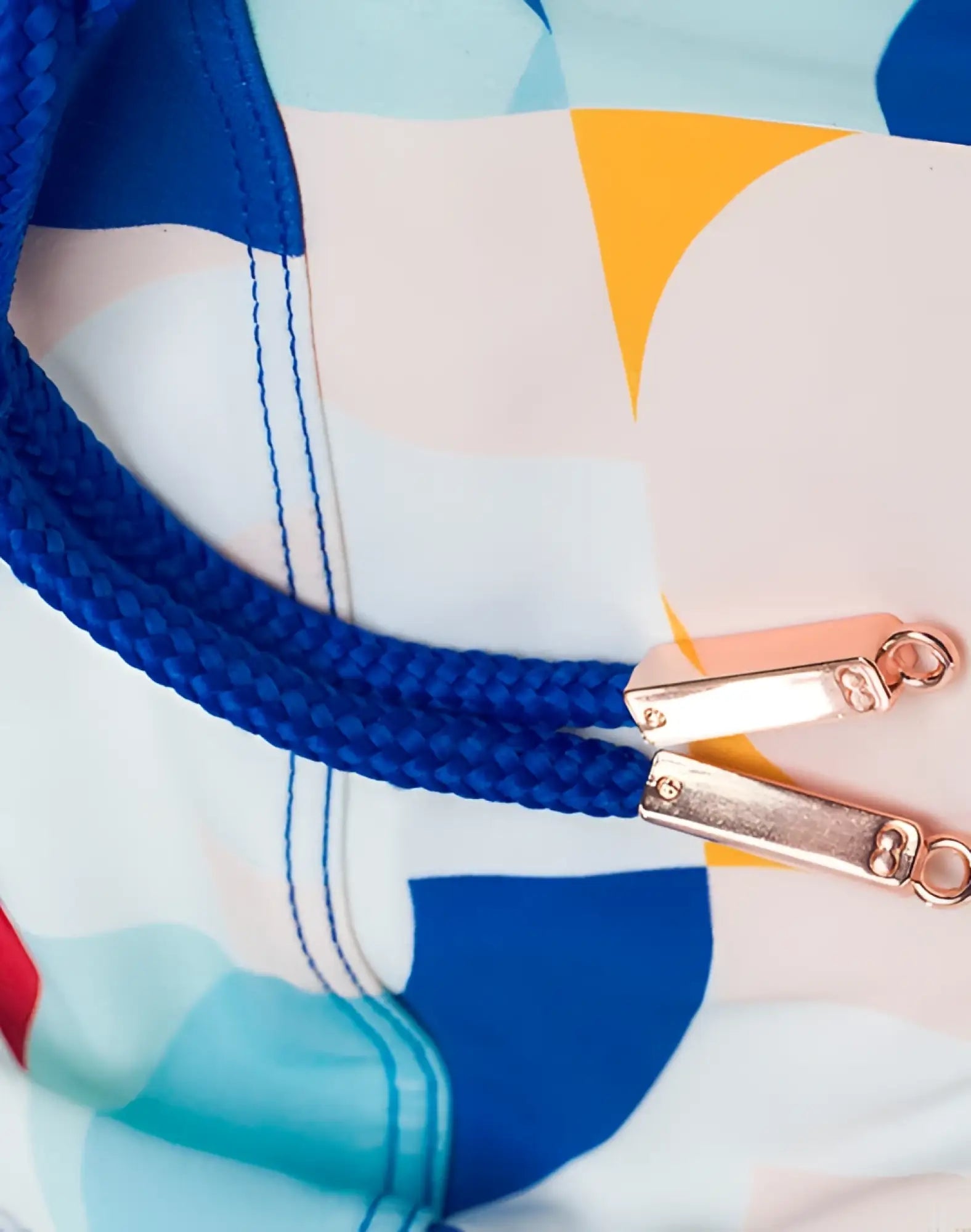 Blue braided drawstring with rose gold metal sliders on 2EROS V10 print swim brief insignia turquoise fabric