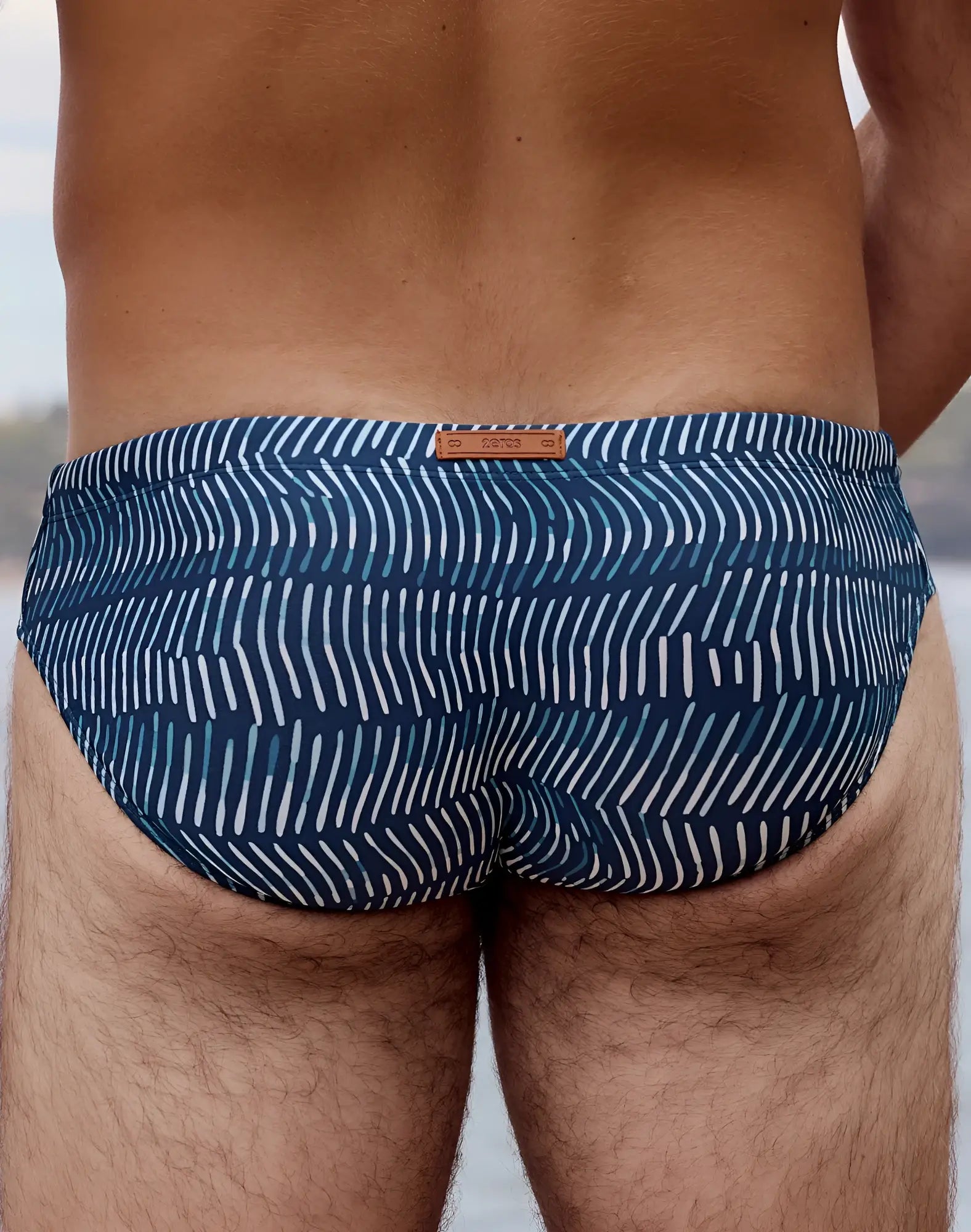 2eros v10 print swim brief in naiad navy blue and white patterned fabric with subtle textured design
