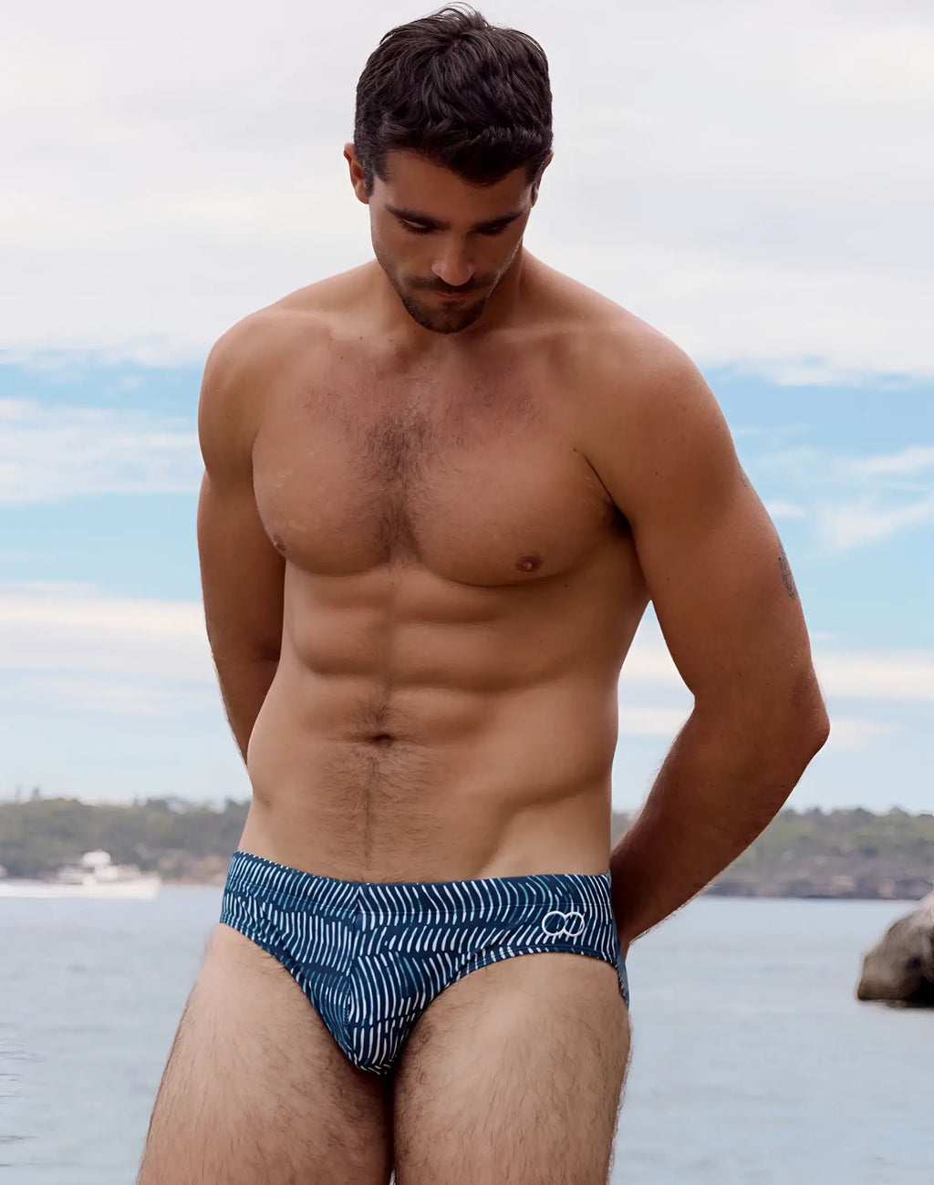 2eros v10 print swim brief in naiad navy with blue and white geometric patterned fabric for swimming and beach use
