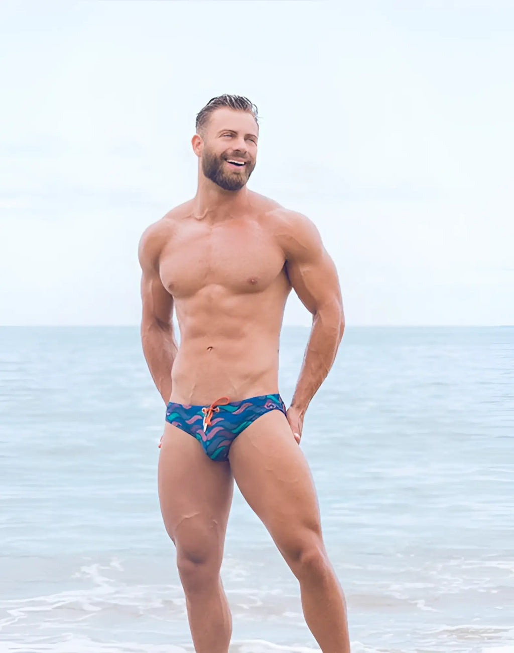 Blue patterned swim trunks with orange drawstrings from 2EROS V10 print swim brief ocean blue collection