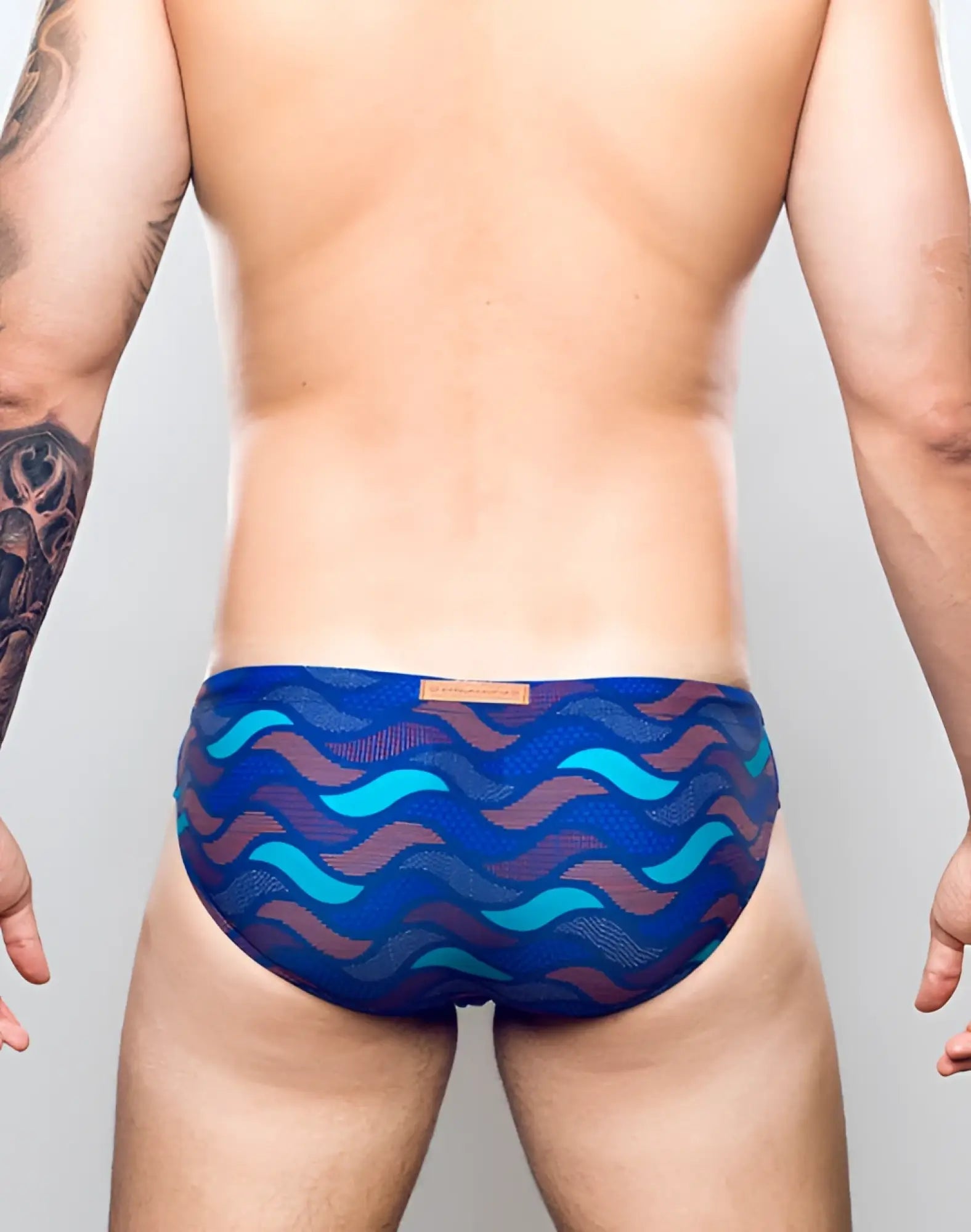 2eros v10 print swim brief ocean blue in blue and teal wave pattern with mesh texture