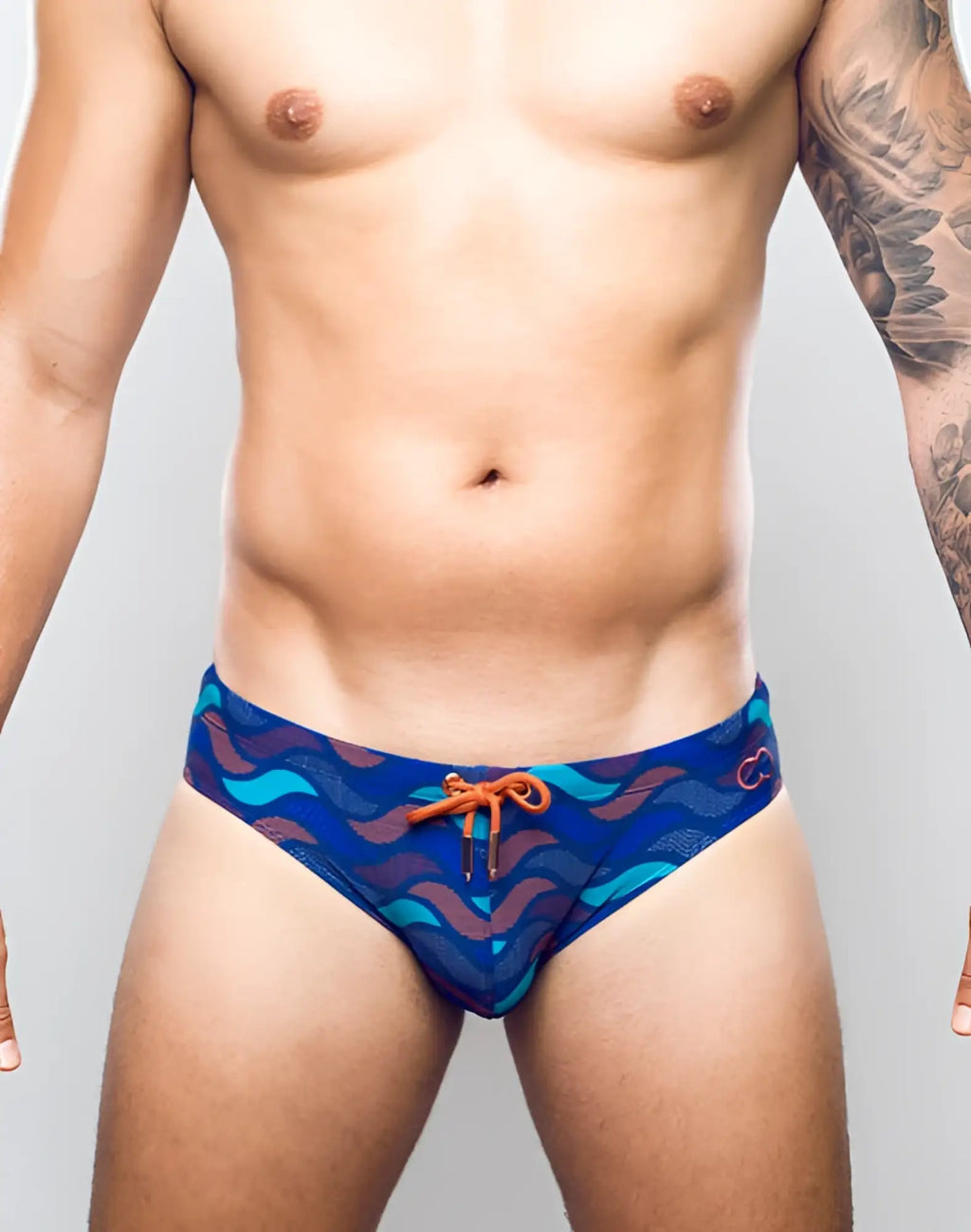 2EROS V10 print swim brief in ocean blue with teal and maroon wavy pattern and orange drawstring for swimming