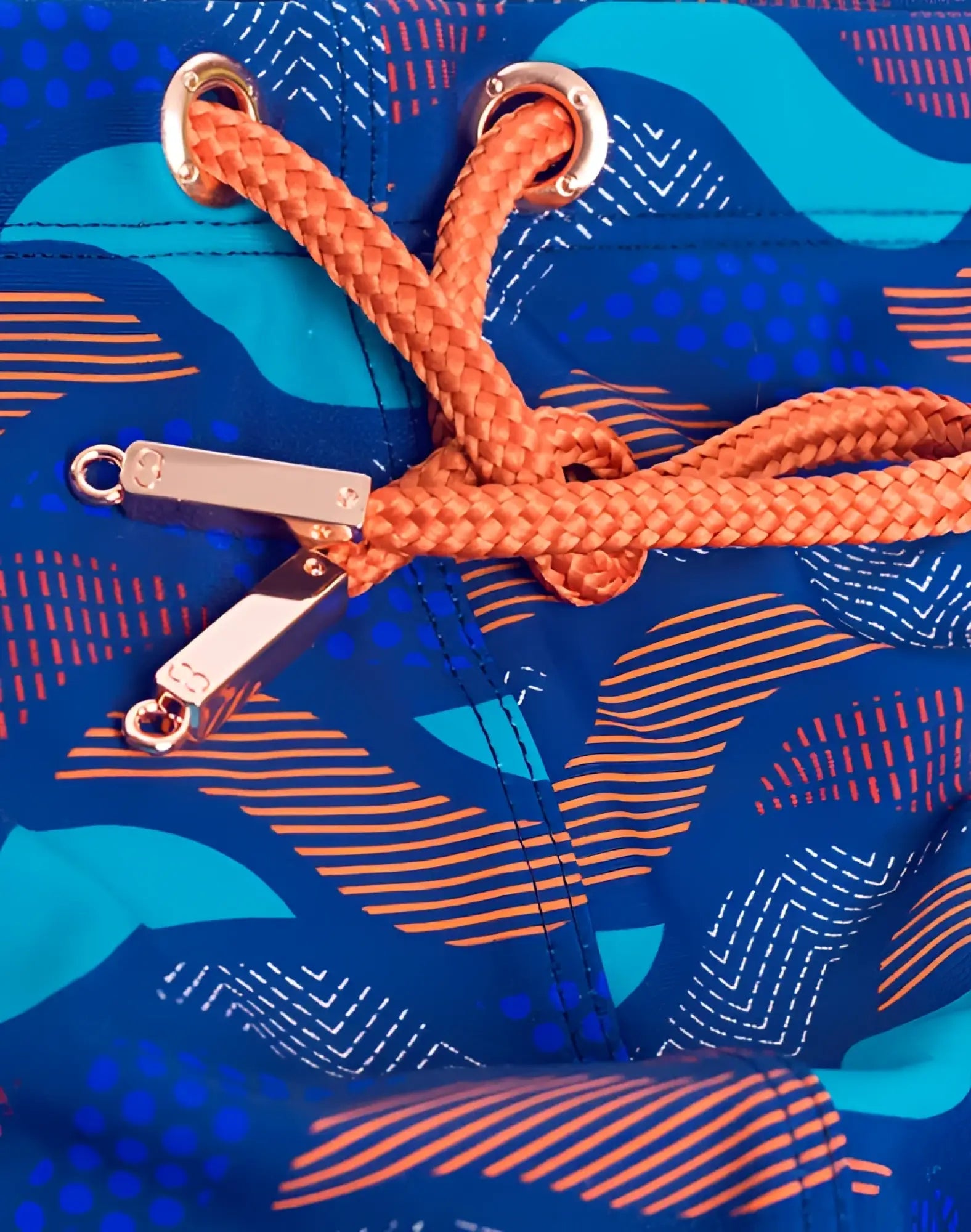 2eros v10 print swim brief ocean blue with vibrant blue geometric wave pattern orange braided drawstrings and silver hardware