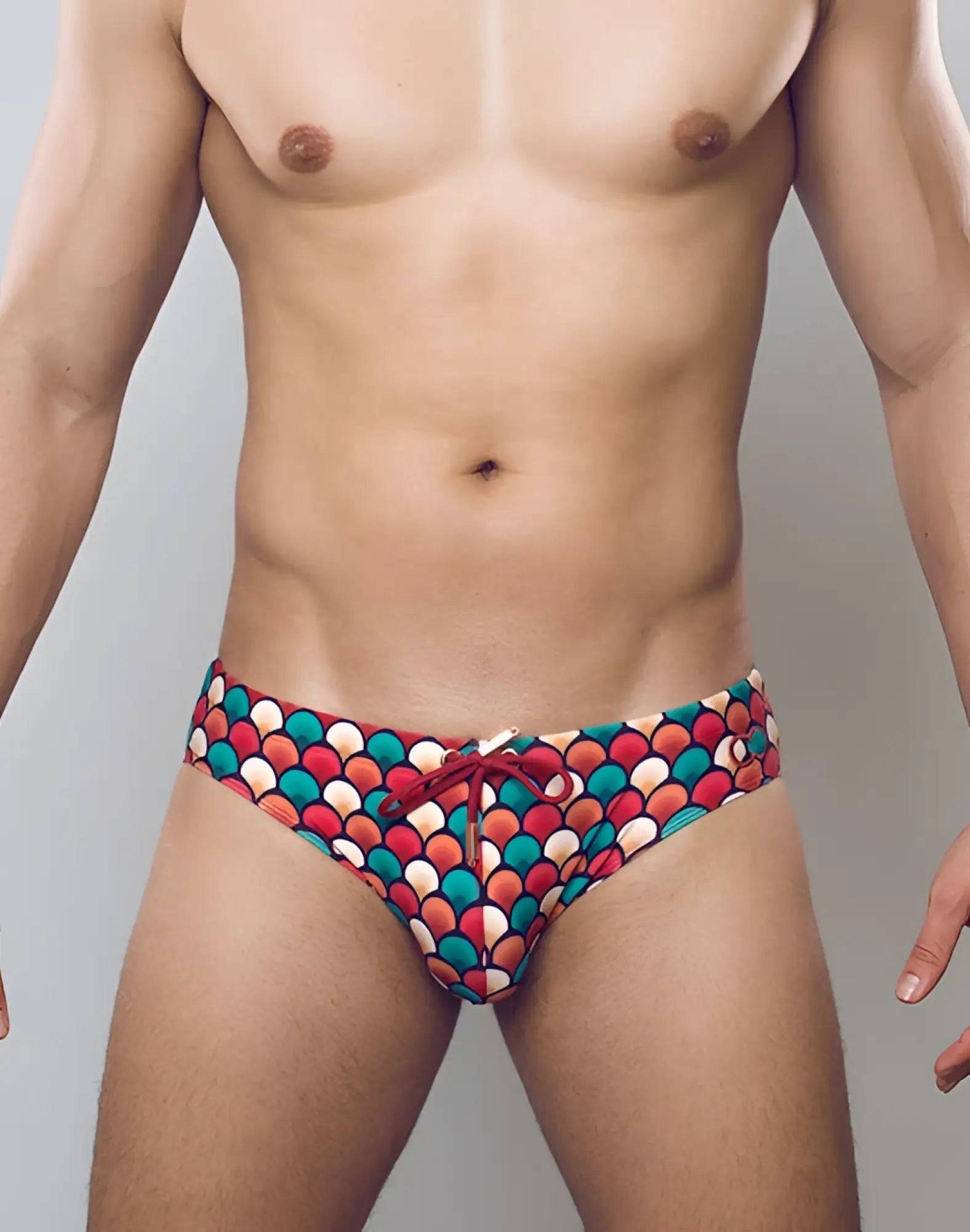 2eros v10 print swim brief in retro red with colorful scalloped pattern and red drawstring for swimming